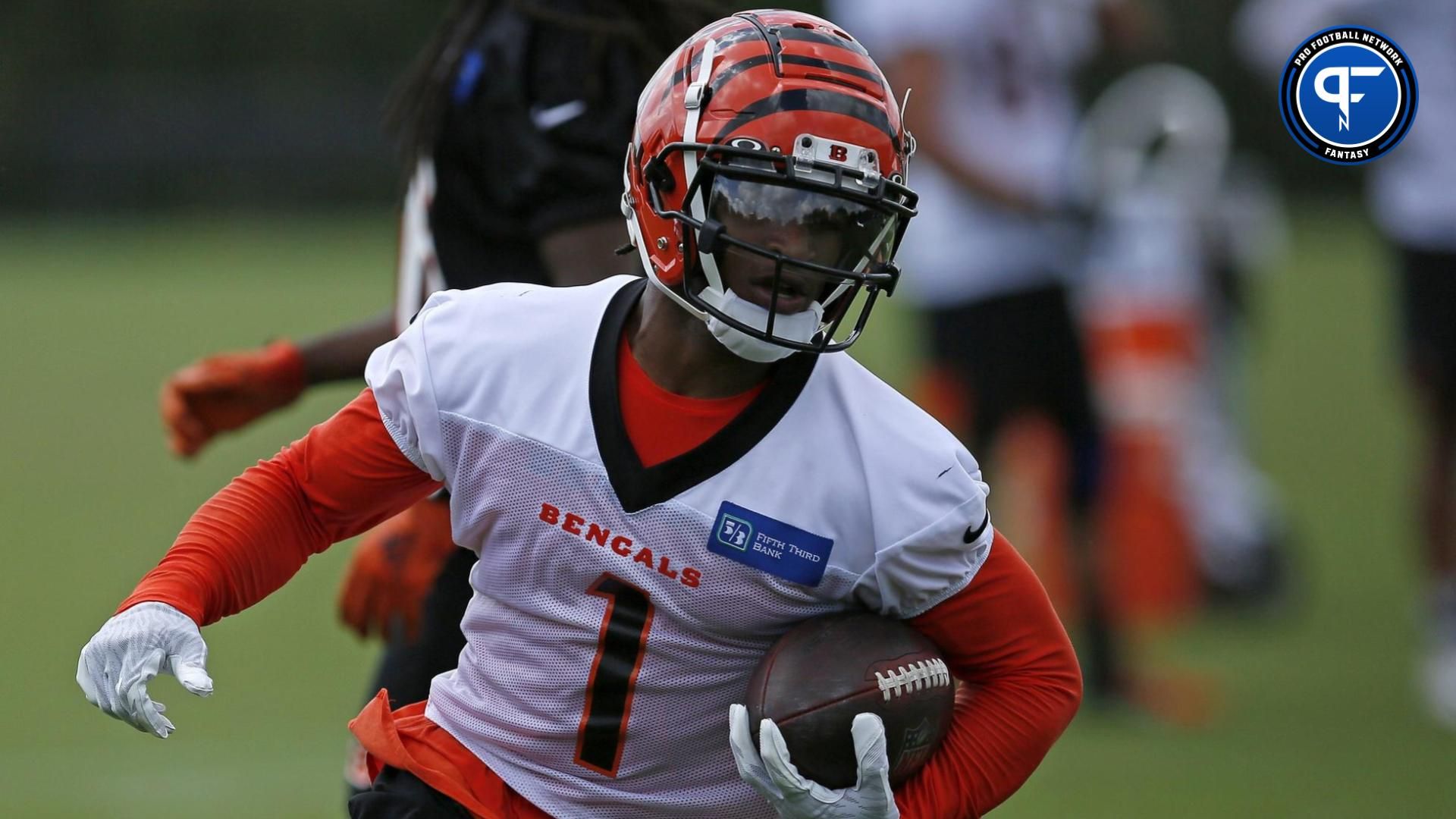 Cincinnati Bengals wide receiver Ja'Marr Chase (1) runs down field after a catch during a training camp practice at the Paul Brown stadium practice facility in downtown Cincinnati on Wednesday, Aug. 18, 2021. What is Ja'Marr Chase's fantasy value compared to others?