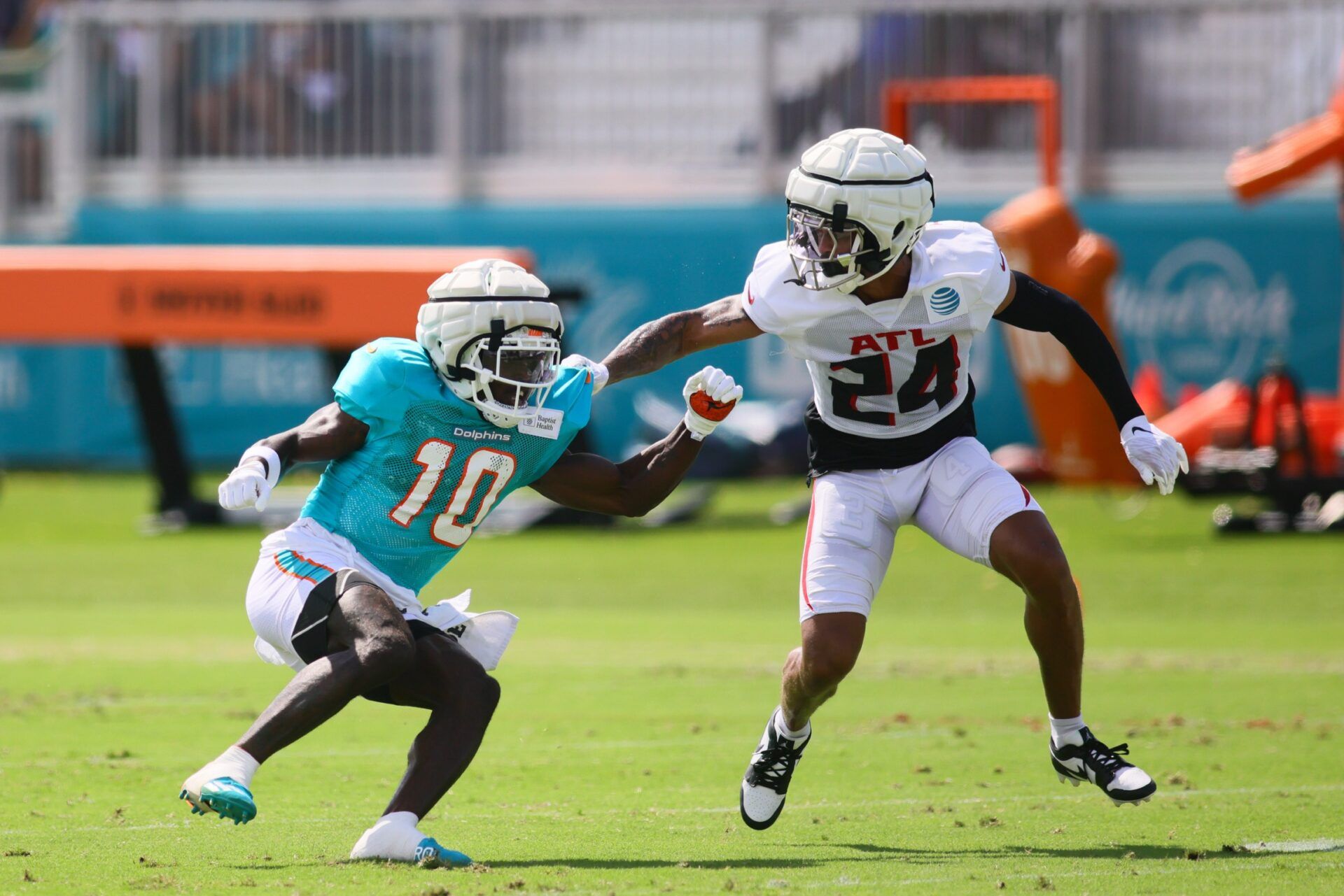 Atlanta Falcons CB A.J. Terrell (24) covers Miami Dolphins WR Tyreek Hill (10) in a joint practice.