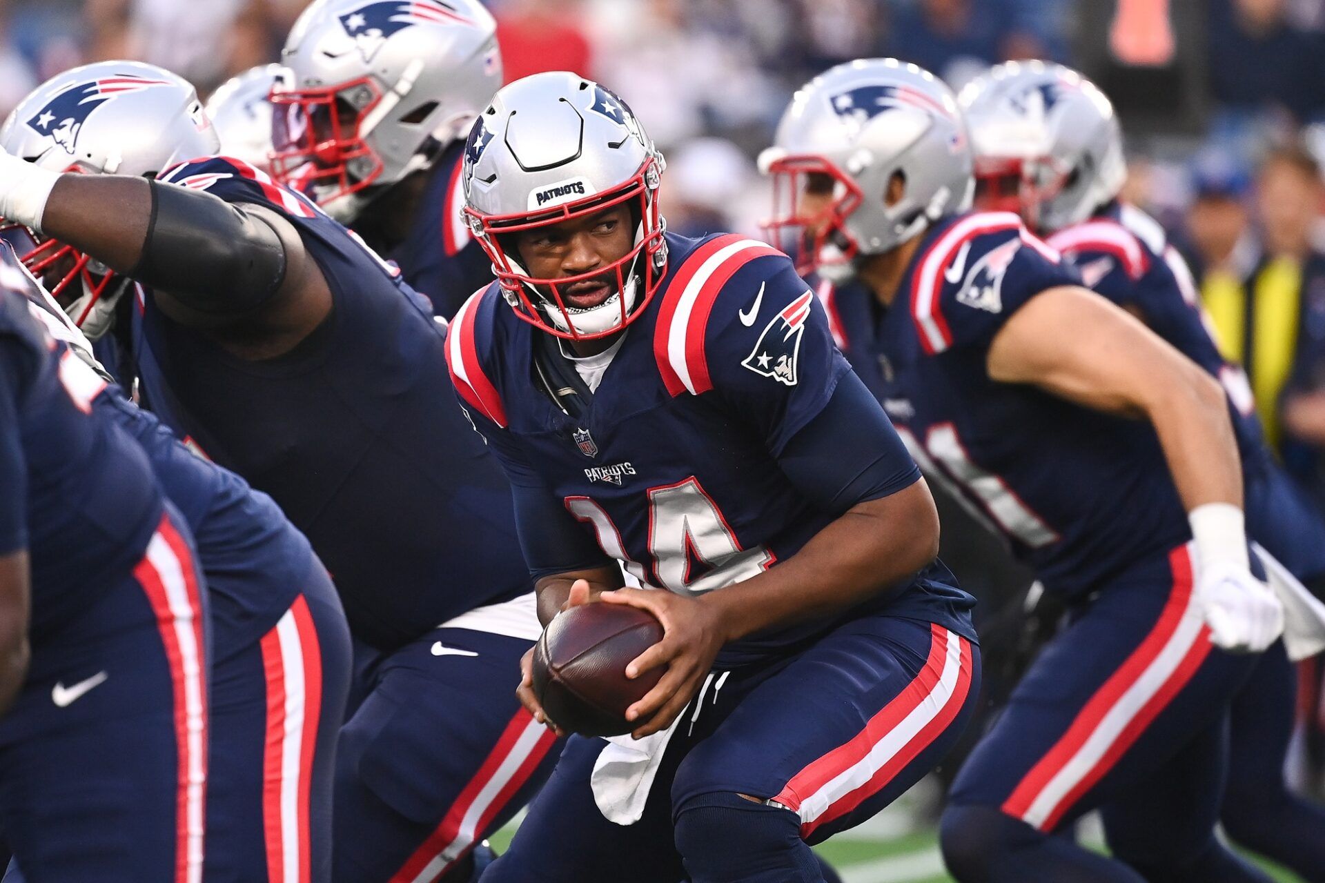 New England Patriots quarterback Jacoby Brissett (14) looks to hand off the ball during the first half against the Philadelphia Eagles at Gillette Stadium. Mandatory Credit: Eric Canha-USA TODAY Sports