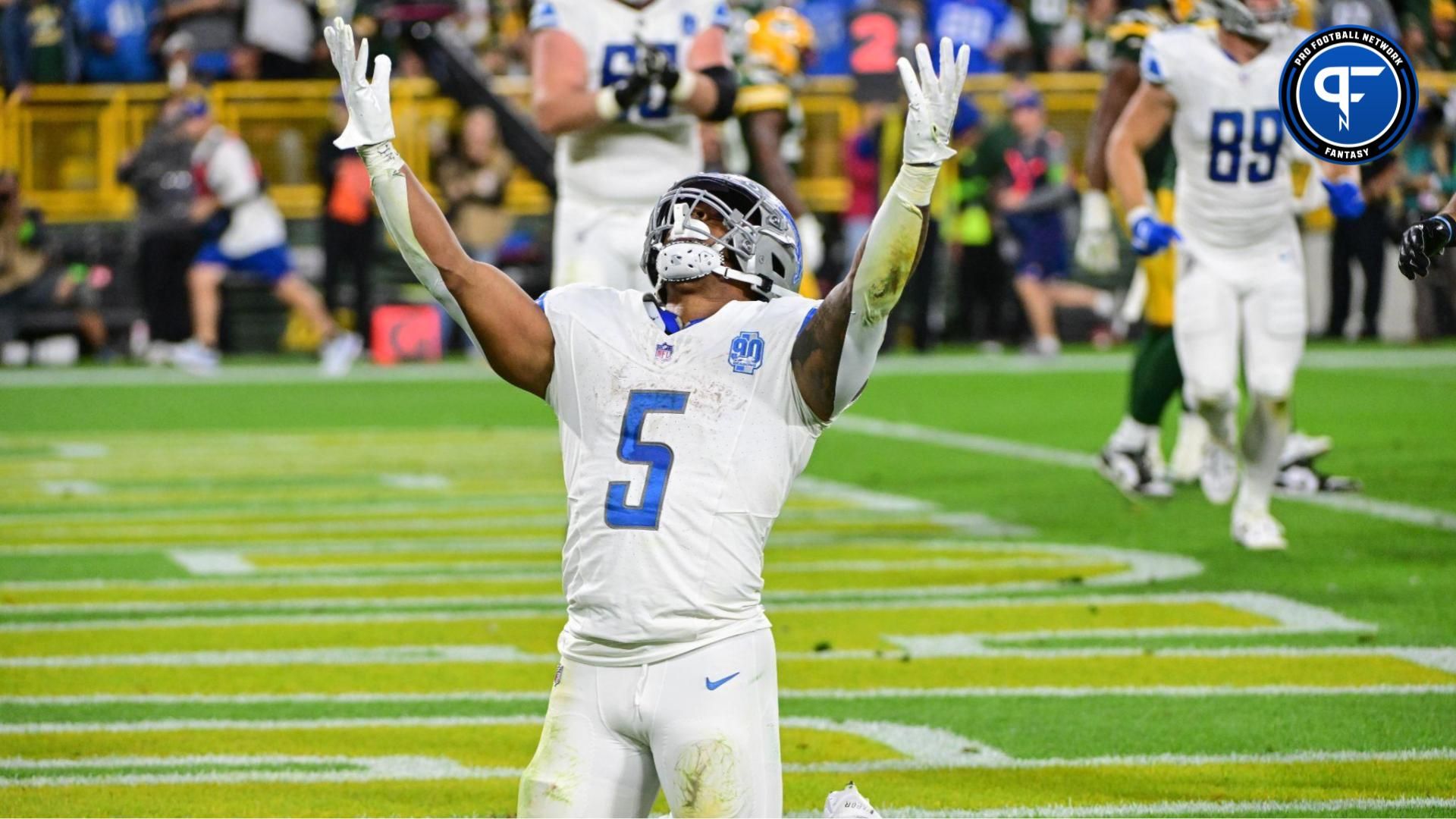 Detroit Lions running back David Montgomery (5) reacts after scoring a touchdown in the second quarter against the Green Bay Packers at Lambeau Field. Mandatory Credit: Benny Sieu-USA TODAY Sports