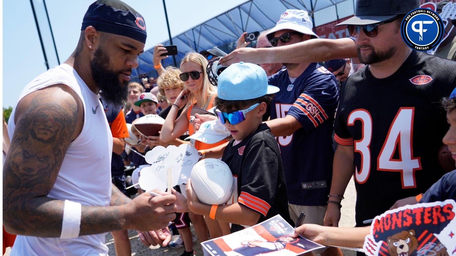 Jul 27, 2024; Lake Forest, IL, USA; Chicago Bears wide receiver Keenan Allen (13) signs autographs during Chicago Bears Training Camp at Halas Hall. Mandatory Credit: David Banks-USA TODAY Sports