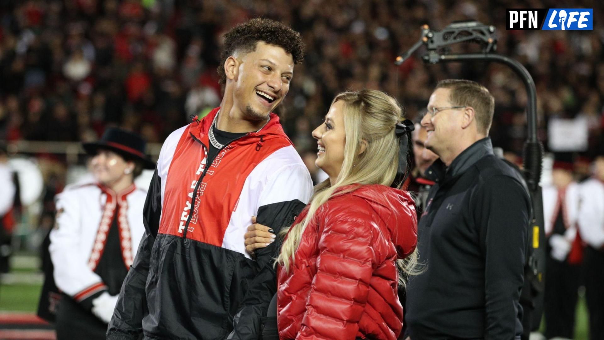 Kansas City Chiefs quarterback Patrick Mahomes shares a laugh with his wife Brittany Mahomes during his Ring of Honor induction during halftime of the game between the Texas Tech Red Raiders and the Baylor Bears at Jones AT&T Stadium and Cody Campbell Field.