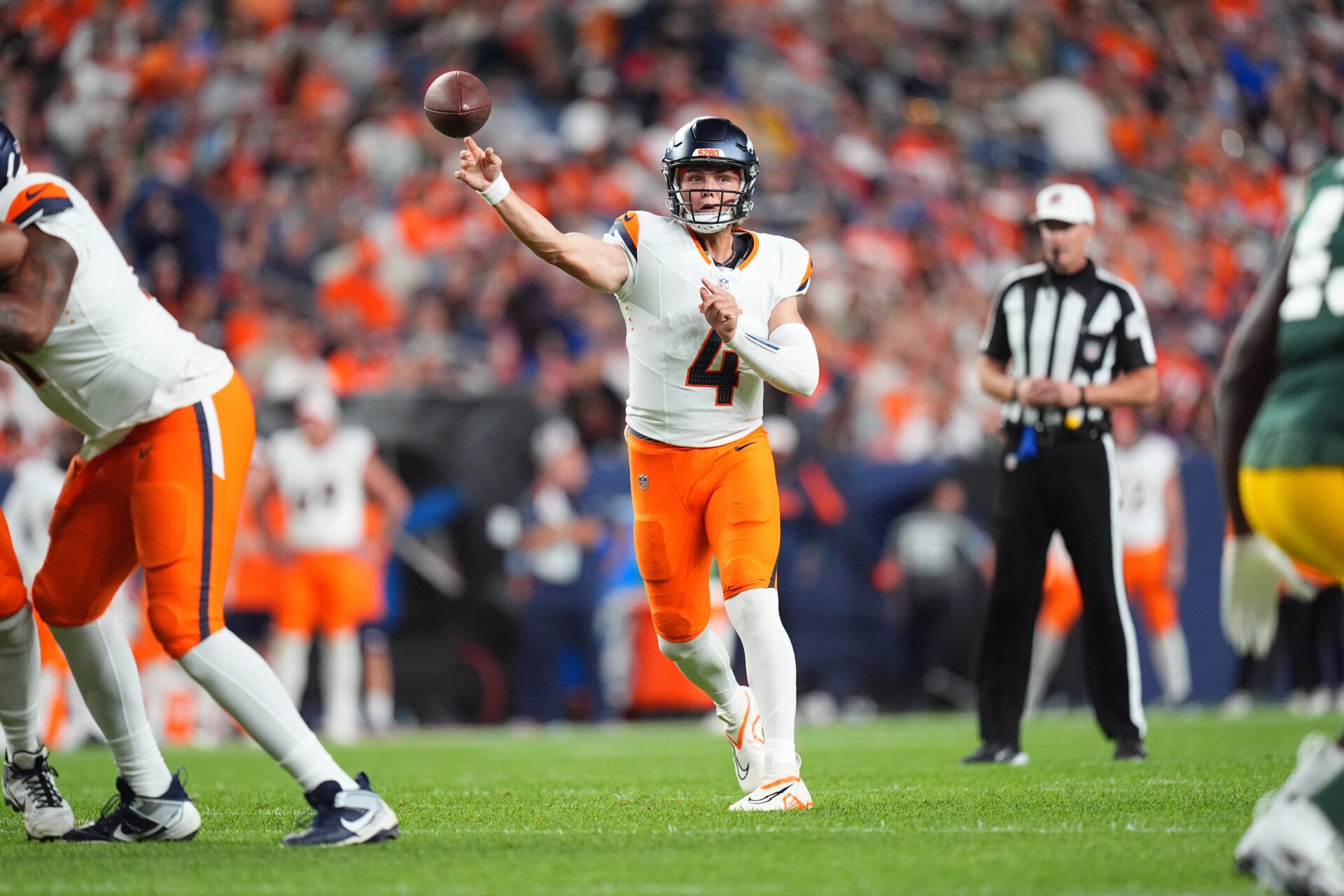 Aug 18, 2024; Denver, Colorado, USA; Denver Broncos quarterback Zach Wilson (4) passes the ball in the second half against the Green Bay Packers at Empower Field at Mile High. Mandatory Credit: Ron Chenoy-USA TODAY Sports
