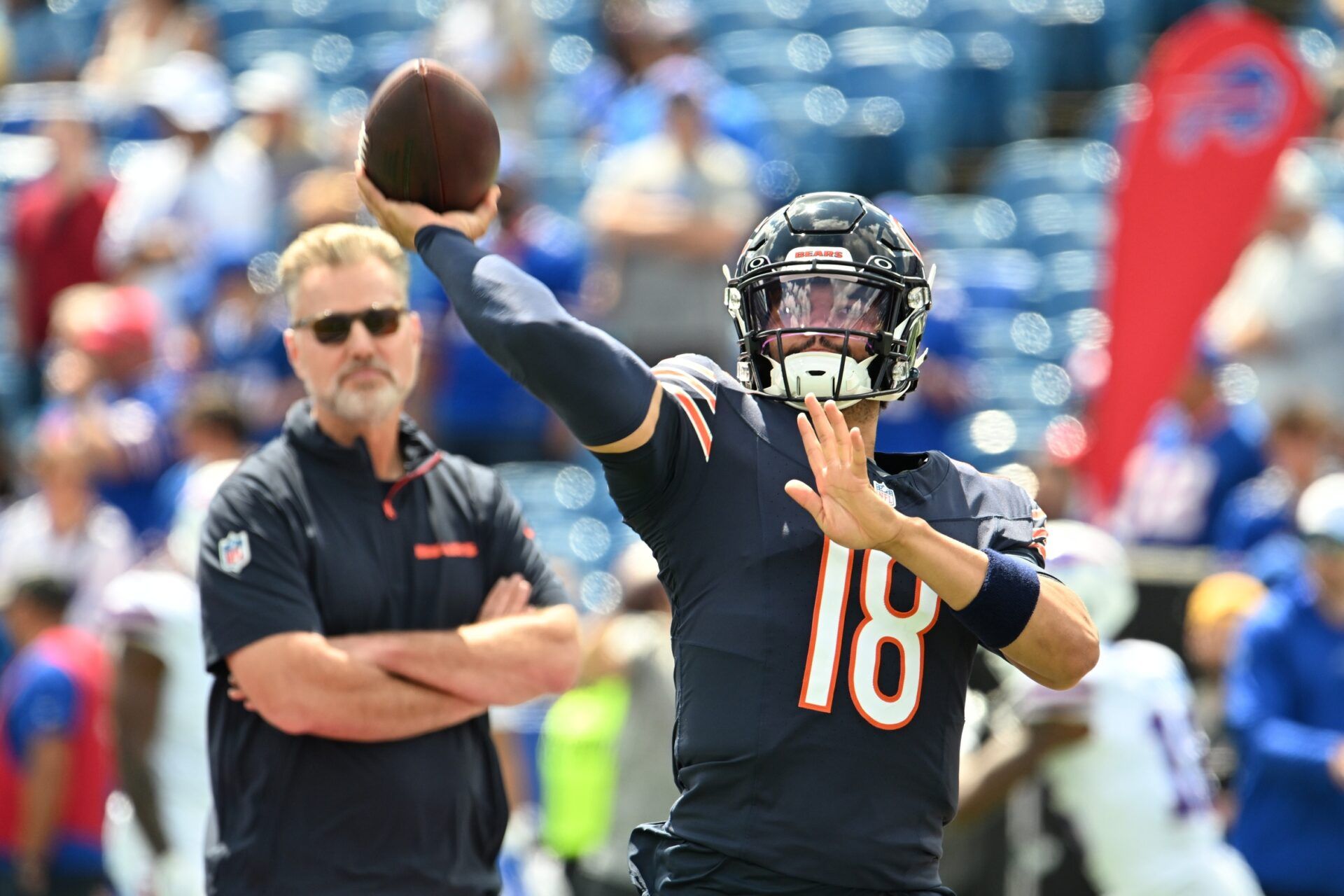 Chicago Bears quarterback Caleb Williams (18) throws a pass in warm ups with head coach Matt Eberflus looking on before a pre-season game against the Buffalo Bills at Highmark Stadium. Mandatory Credit: Mark Konezny-USA TODAY Sports