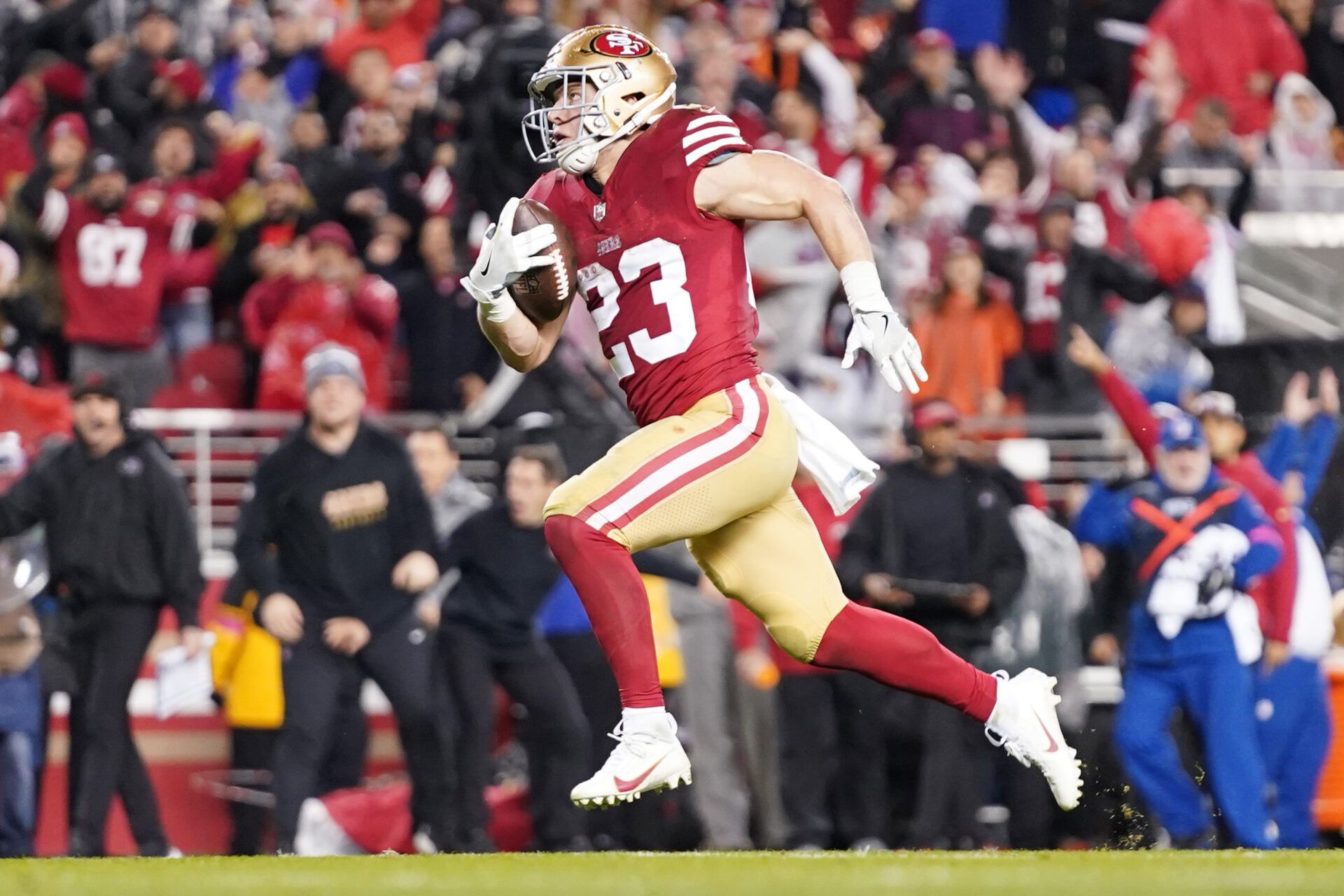 January 20, 2024; Santa Clara, CA, USA; San Francisco 49ers running back Christian McCaffrey (23) runs to score a touchdown against the Green Bay Packers during the third quarter in a 2024 NFC divisional round game at Levi's Stadium. Mandatory Credit: Kyle Terada-USA TODAY Sports