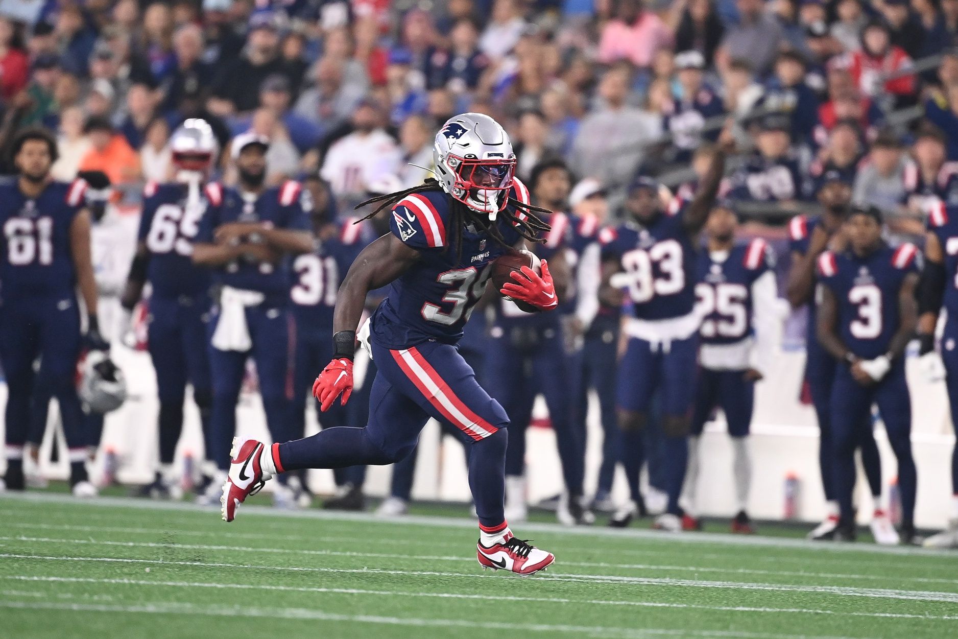 New England Patriots running back JaMycal Hasty (39) runs the ball during the first half at Gillette Stadium.