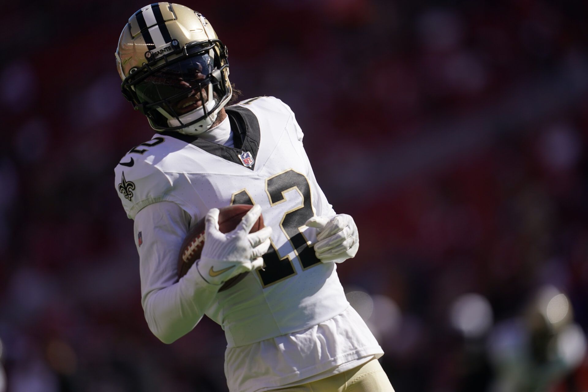 Aug 18, 2024; Santa Clara, California, USA; New Orleans Saints wide receiver Chris Olave (12) runs with the ball before the start of the game against the San Francisco 49ers at Levi's Stadium. Mandatory Credit: Cary Edmondson-USA TODAY Sports