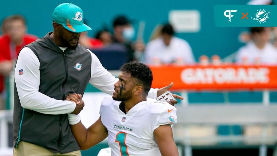 Miami Dolphins head coach Brian Flores, shakes hands with Miami Dolphins quarterback Tua Tagovailoa (1), before the start of their game agains the New York Giants during NFL game at Hard Rock Stadium Sunday in Miami Gardens. Giants V Dolphins 09