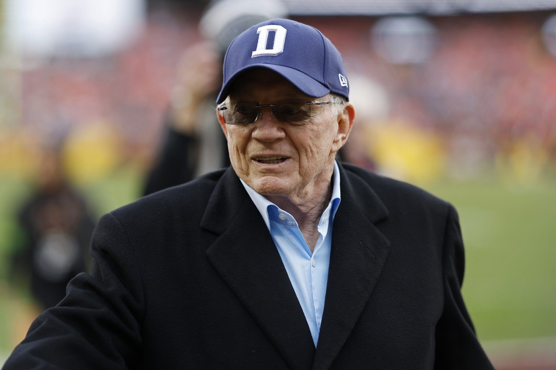 Dallas Cowboys owner Jerry Jones walks off the field after warmups prior to the game against the Washington Commanders at FedExField. Mandatory Credit: Geoff Burke-USA TODAY Sports