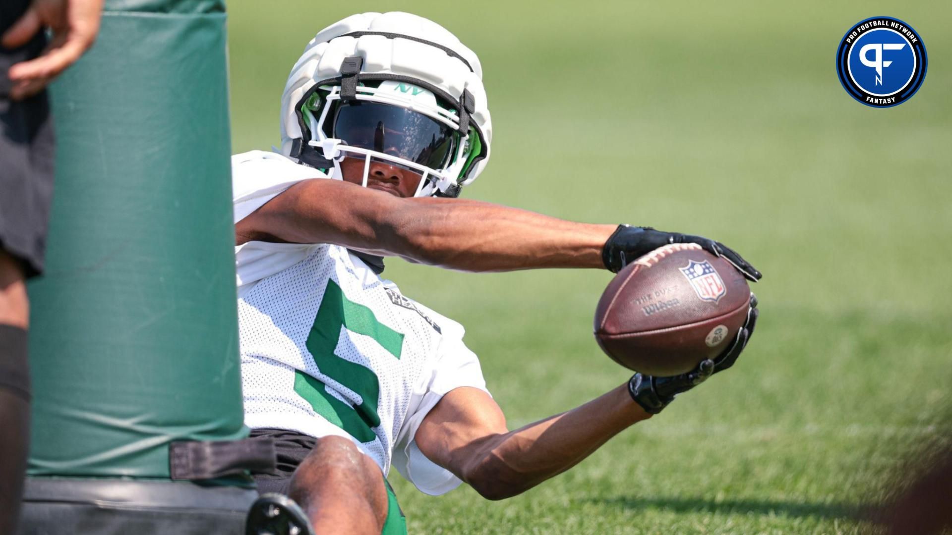 New York Jets wide receiver Garrett Wilson (5) catches the ball during a drill during training camp at Atlantic Health Jets Training Center.