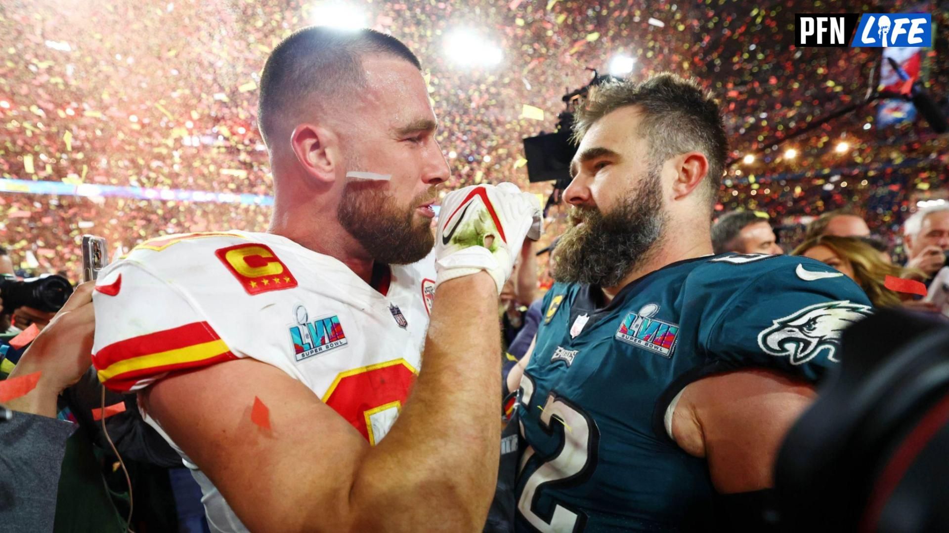 Kansas City Chiefs tight end Travis Kelce (87) talks with his brother Philadelphia Eagles center Jason Kelce (62) after he won Super Bowl LVII at State Farm Stadium.