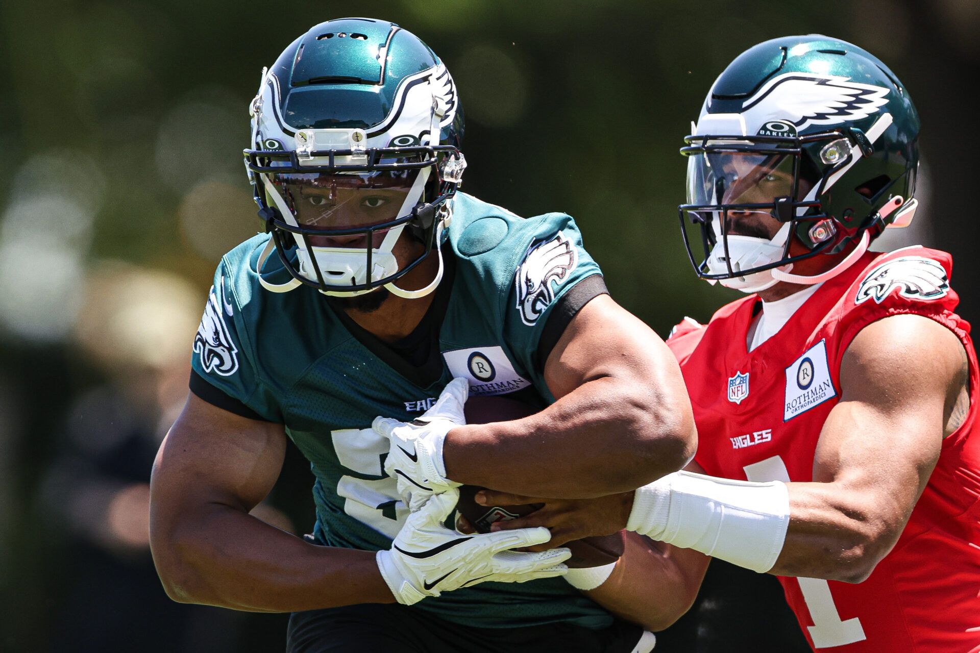 May 30, 2024; Philadelphia, PA, USA; Philadelphia Eagles quarterback Jalen Hurts (1) hands off to running back Saquon Barkley (26) during practice at NovaCare Complex. Mandatory Credit: Bill Streicher-USA TODAY Sports