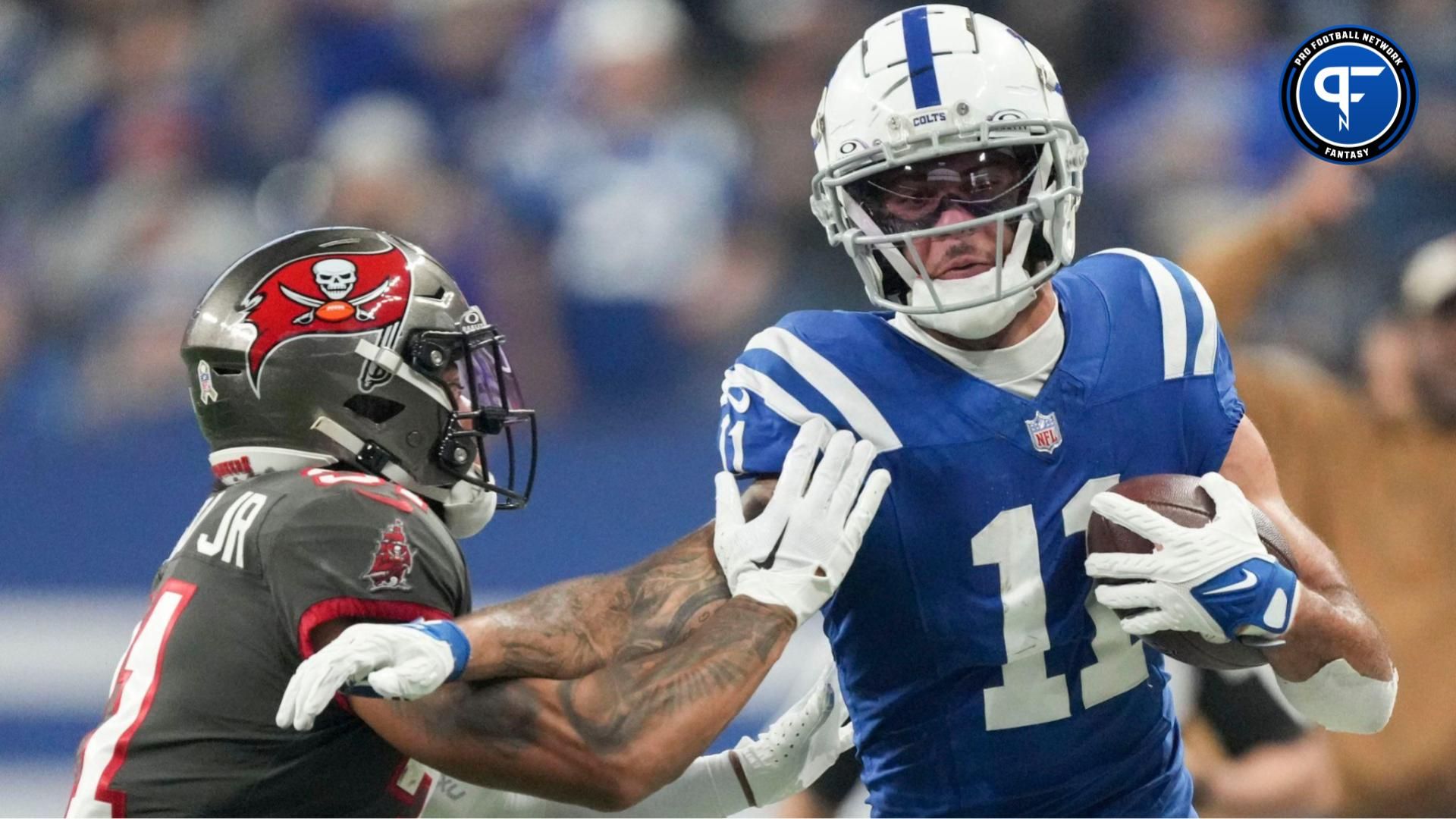 Tampa Bay Buccaneers safety Antoine Winfield Jr. (31) works to push Indianapolis Colts wide receiver Michael Pittman Jr. (11) out of bounds Sunday, Nov. 26, 2023, during a game against the Tampa Bay Buccaneers at Lucas Oil Stadium in Indianapolis.