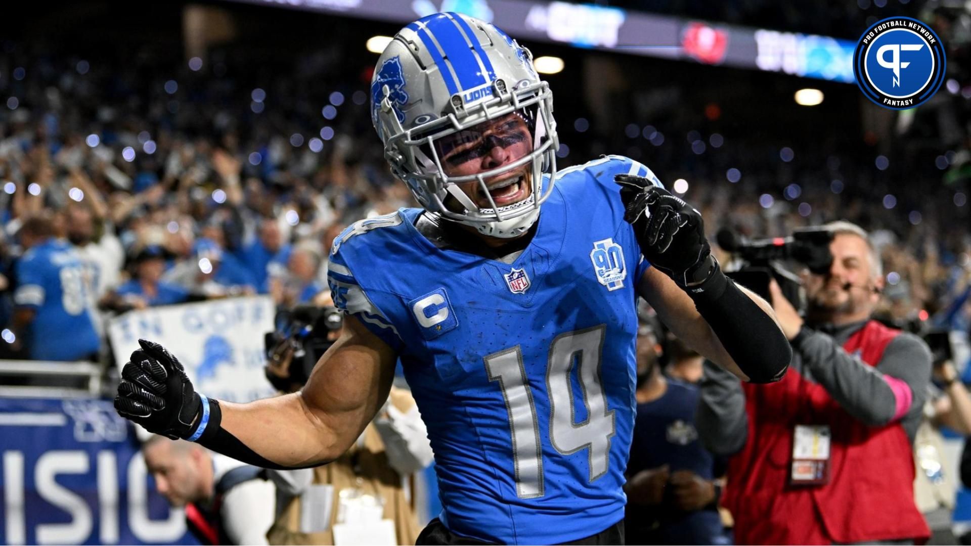 Detroit Lions wide receiver Amon-Ra St. Brown (14) celebrates after scoring a touchdown against the Tampa Bay Buccaneers during the second half in a 2024 NFC divisional round game at Ford Field. Mandatory Credit: Lon Horwedel-USA TODAY Sports