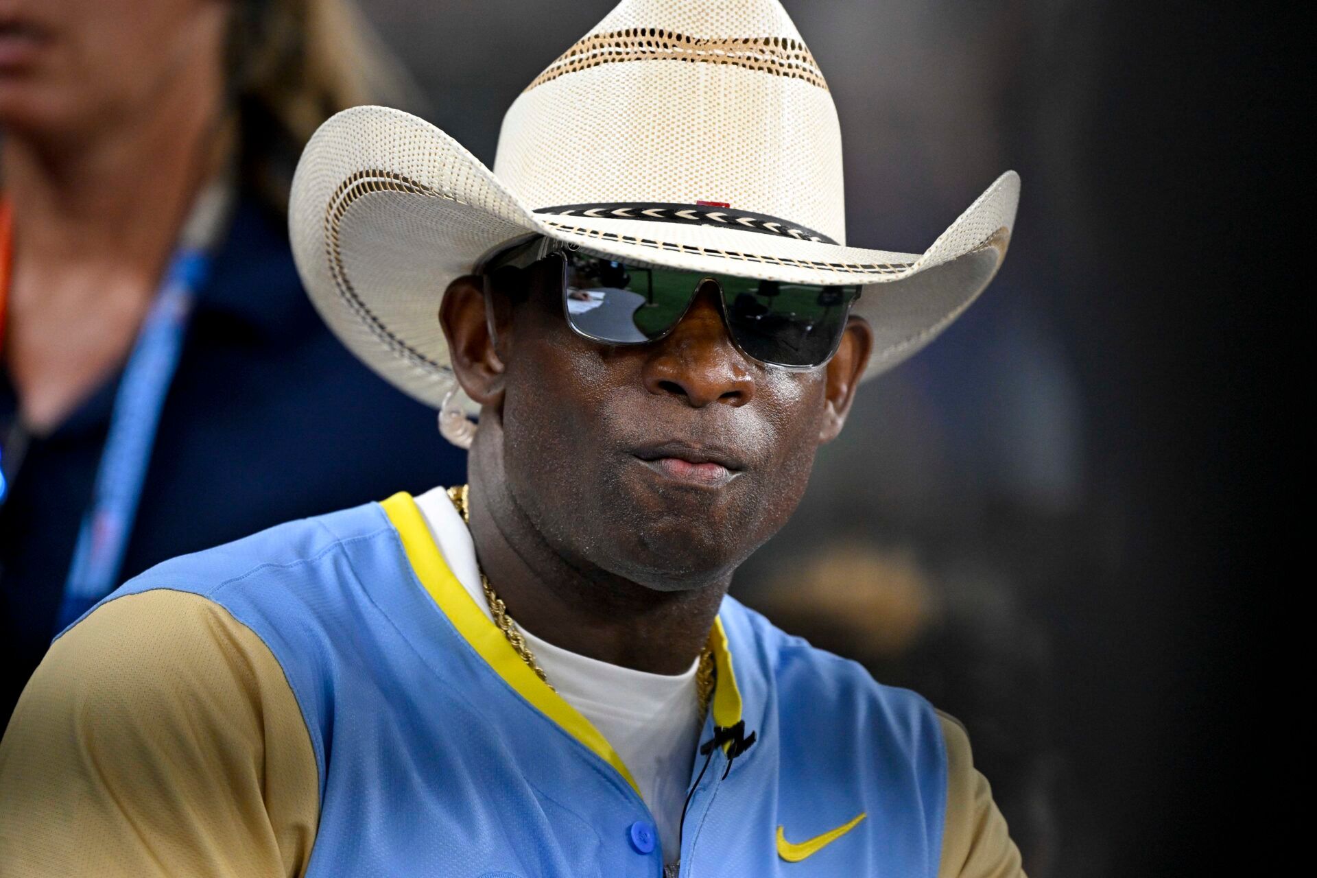 Jul 13, 2024; Arlington, TX, USA; Colorado Buffalos head coach and former MLB and NFL player Deion Sanders (21) of the National League is interviewed during the 2024 All Star Celebrity Softball Game at Globe Life Field. Mandatory Credit: Jerome Miron-USA TODAY Sports