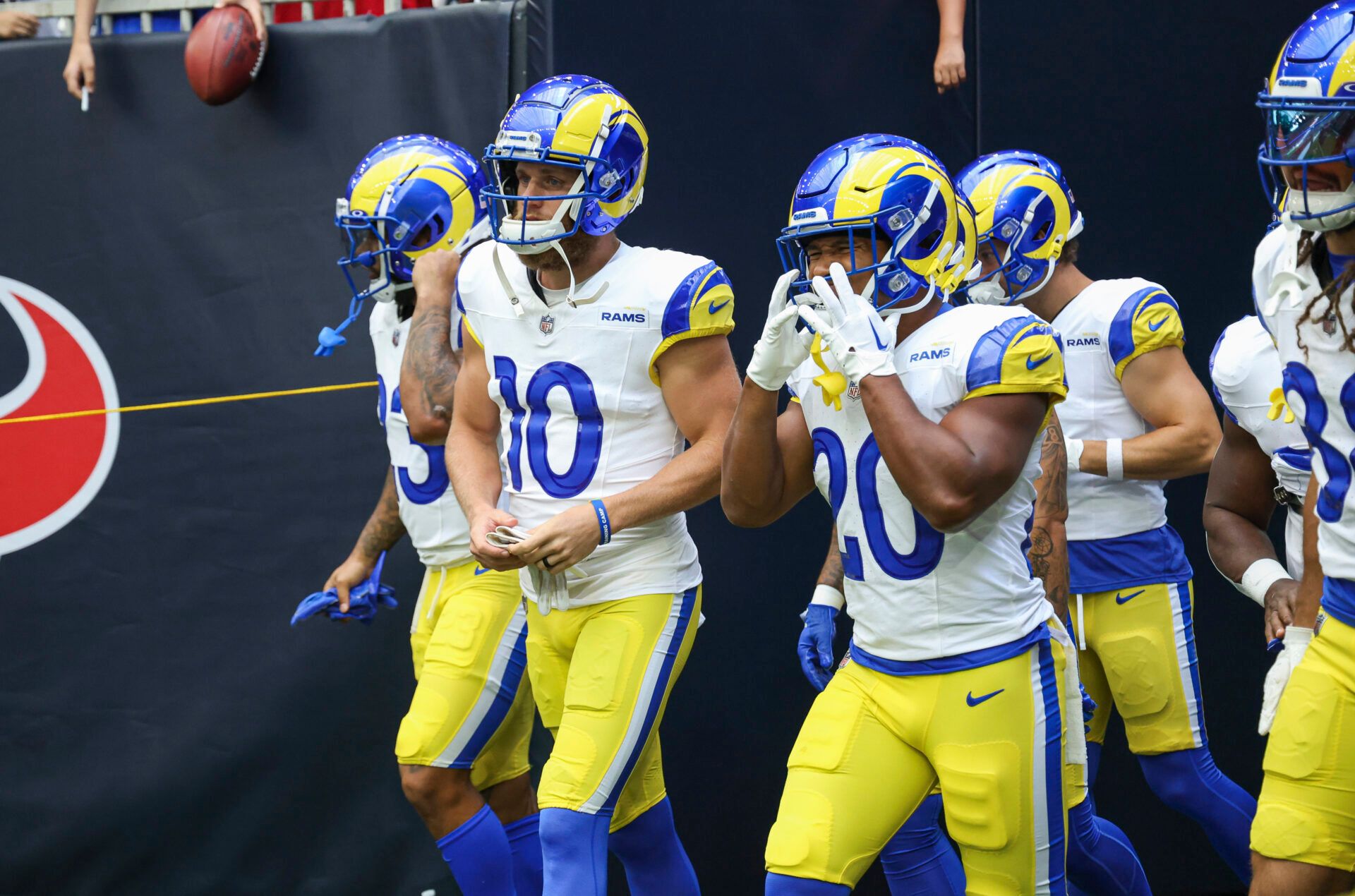 Aug 24, 2024; Houston, Texas, USA; Los Angeles Rams wide receiver Cooper Kupp (10) and running back Ronnie Rivers (20) walk onto the field before the game against the Houston Texans at NRG Stadium. Mandatory Credit: Troy Taormina-USA TODAY Sports