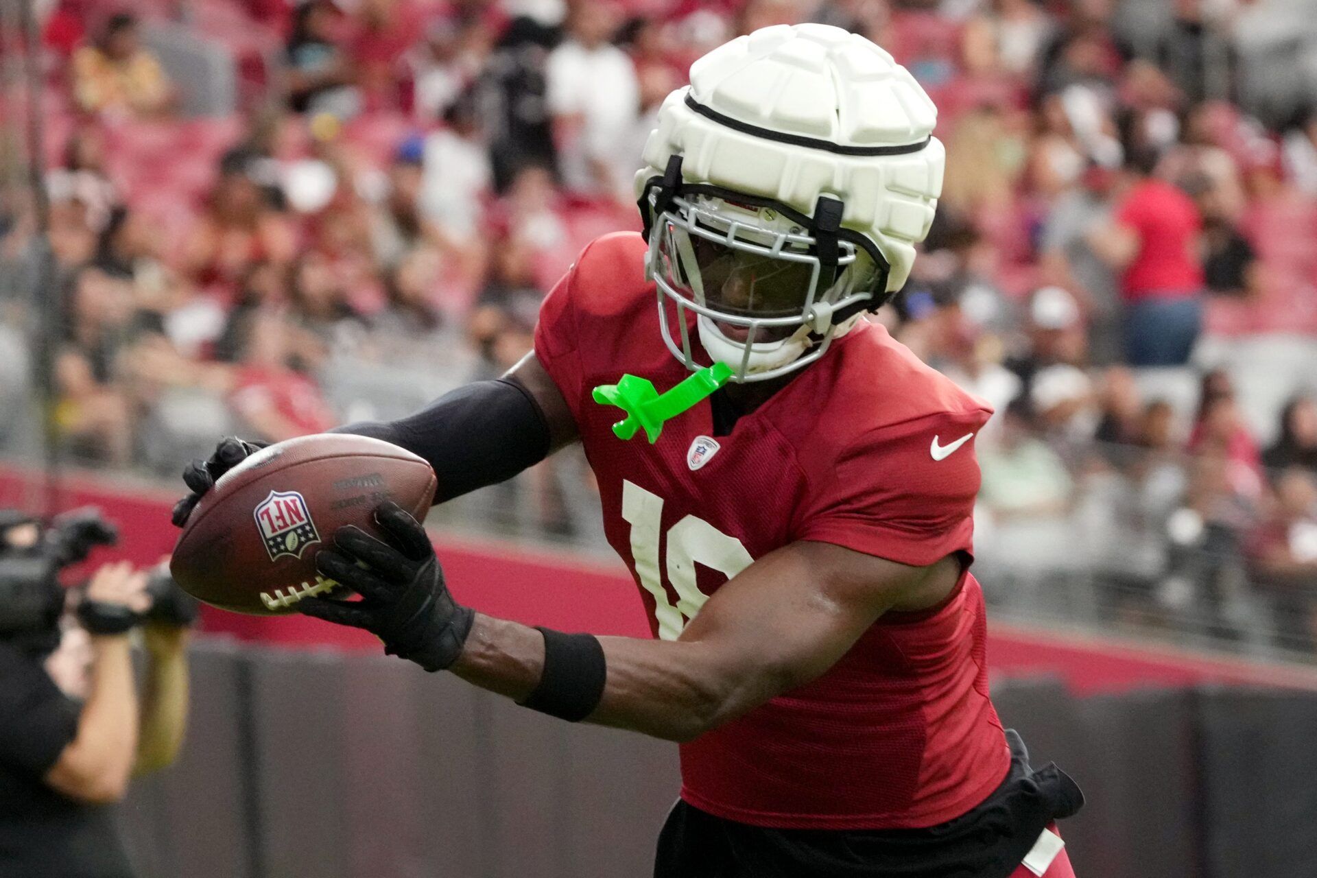 Arizona Cardinals receiver Marvin Harrison Jr. (18) catches a pass in the end. zone during training camp at State Farm Stadium in Glendale, Ariz., on Saturday, Aug. 3, 2024.