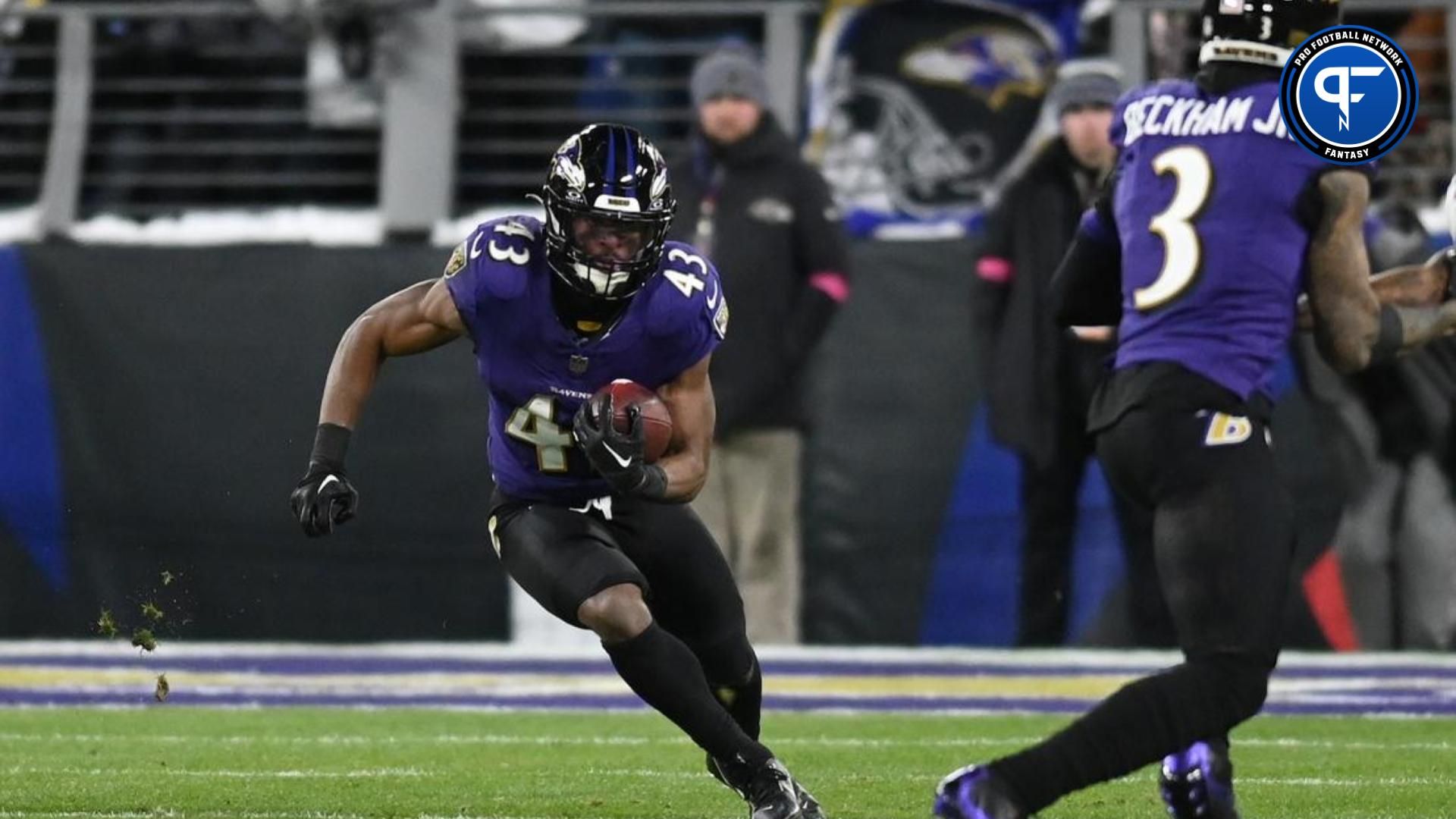 Baltimore Ravens RB Justice Hill (43) runs the ball against the Houston Texans.