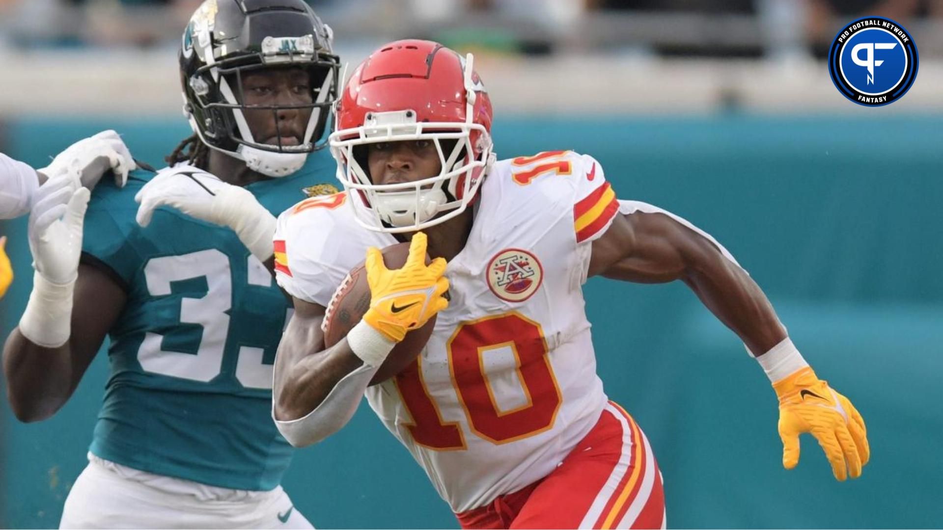 Kansas City Chiefs running back Isiah Pacheco (10) eludes Jacksonville Jaguars linebacker Devin Lloyd (33) and defensive end Travon Walker (44) on an early first quarter run. The Jaguars led 20 to 10 at the end of the first half. The Jacksonville Jaguars hosted the Kansas City Chiefs in the Jaguars first preseason game of the season Saturday, August 10, 2024 at EverBank Stadium in Jacksonville, Fla. [Bob Self/Florida Times-Union]