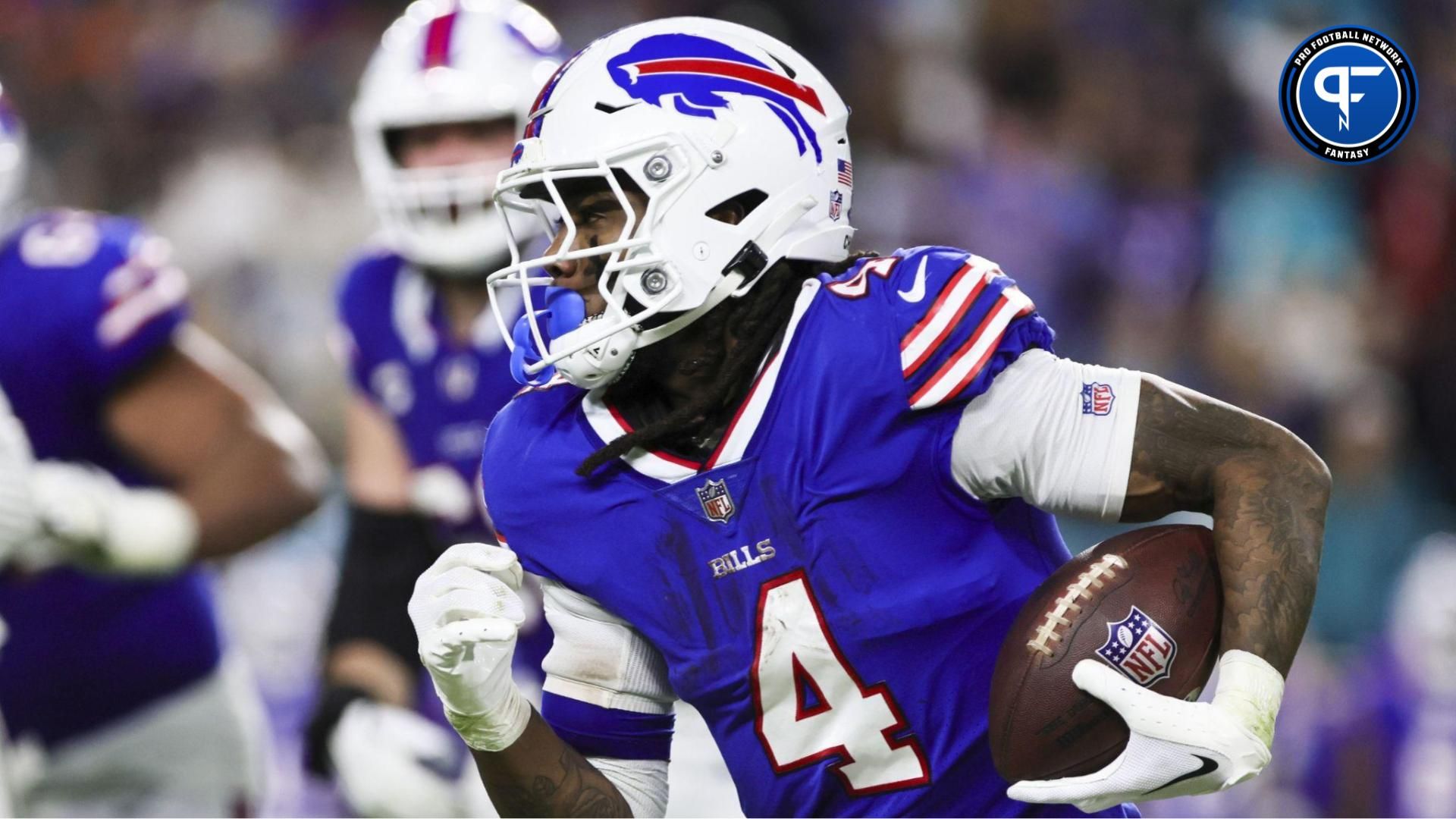 Buffalo Bills running back James Cook (4) runs with the football against the Miami Dolphins during the fourth quarter at Hard Rock Stadium. Mandatory Credit: Sam Navarro-USA TODAY Sports