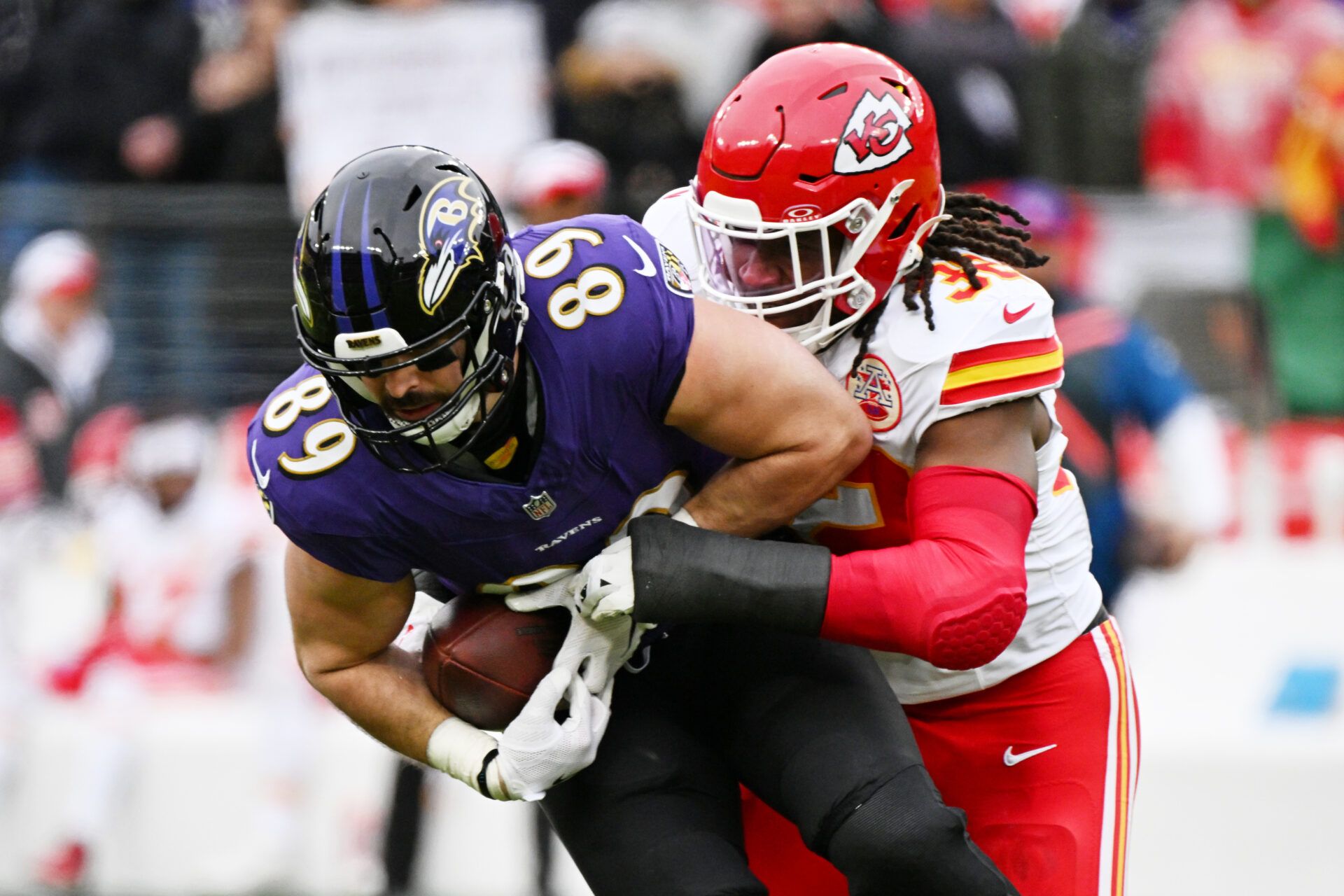 Jan 28, 2024; Baltimore, Maryland, USA; Baltimore Ravens tight end Mark Andrews (89) after making a catch against Kansas City Chiefs linebacker Nick Bolton (32) during the first half in the AFC Championship football game at M&T Bank Stadium. Mandatory Credit: Tommy Gilligan-USA TODAY Sports