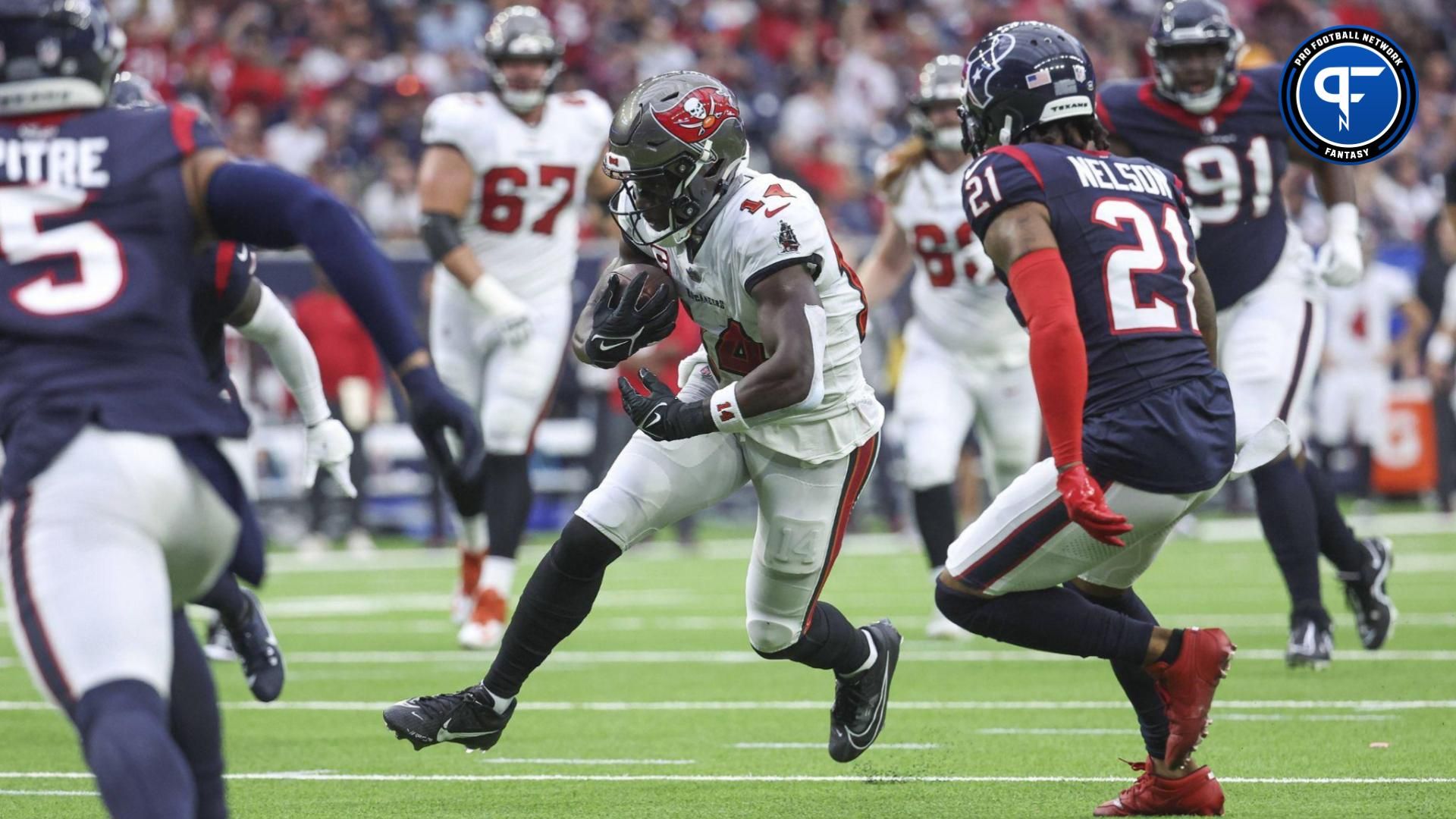 Tampa Bay Buccaneers wide receiver Chris Godwin (14) runs with the ball after a reception during the first quarter against the Houston Texans at NRG Stadium.