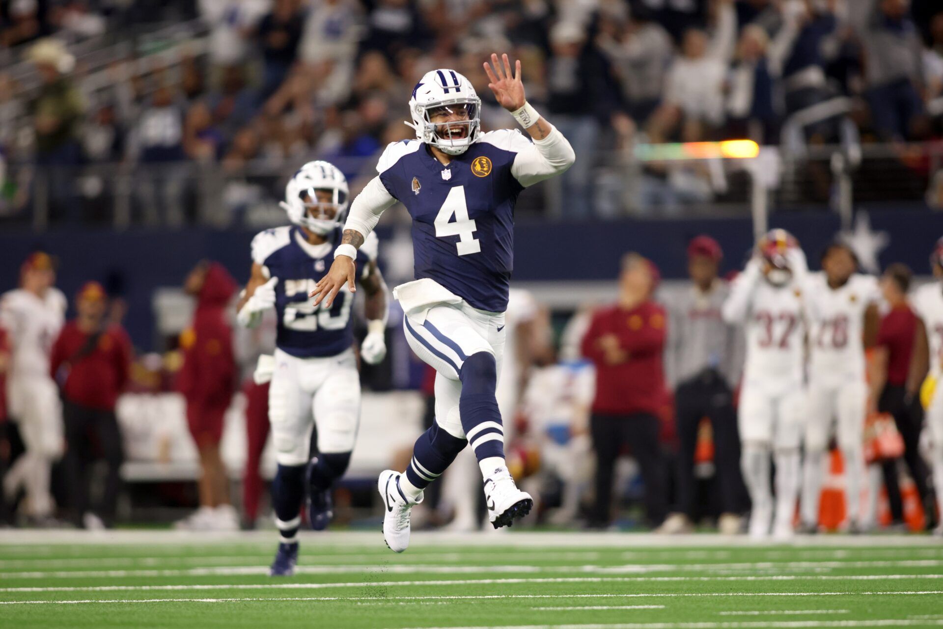 Dallas Cowboys quarterback Dak Prescott (4) celebrates throwing a touchdown in the fourth quarter against the Washington Commanders at AT&T Stadium. Mandatory Credit: Tim Heitman-USA TODAY Sports