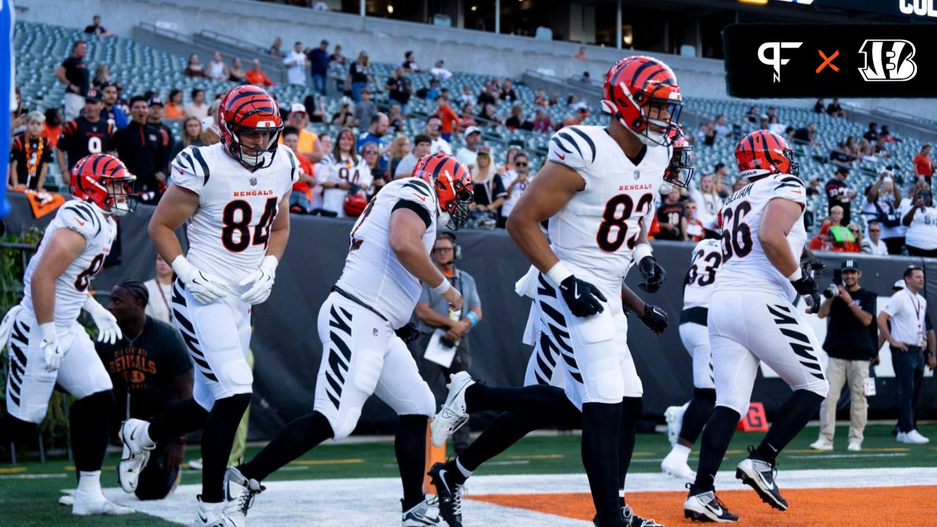 Cincinnati Bengals tight end Tanner McLachlan (84) Cincinnati Bengals tight end Erick All Jr. (83) and other Cincinnati Bengals run onto the field to warm up before NFL preseason game between the Cincinnati Bengals and the Indianapolis Colts at Paycor Stadium in Cincinnati on Thursday, Aug. 22, 2024.