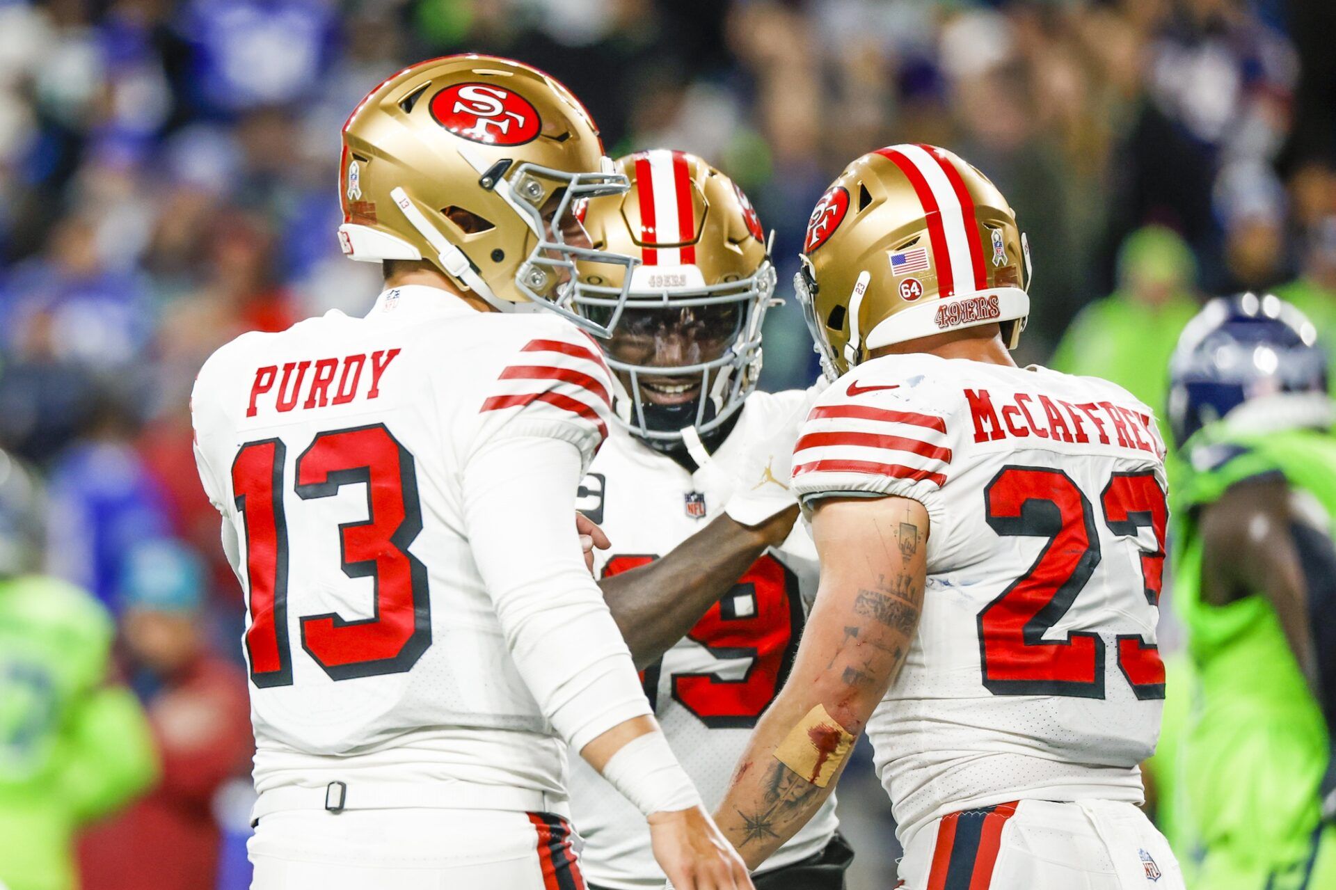 San Francisco 49ers running back Christian McCaffrey (23) celebrates with quarterback Brock Purdy (13) and wide receiver Deebo Samuel (19) after catching a touchdown pass from Purdy against the Seattle Seahawks during the second quarter at Lumen Field. How Many Players of Each Position Should You Draft In Fantasy Football? Mandatory Credit: Joe Nicholson-USA TODAY Sports