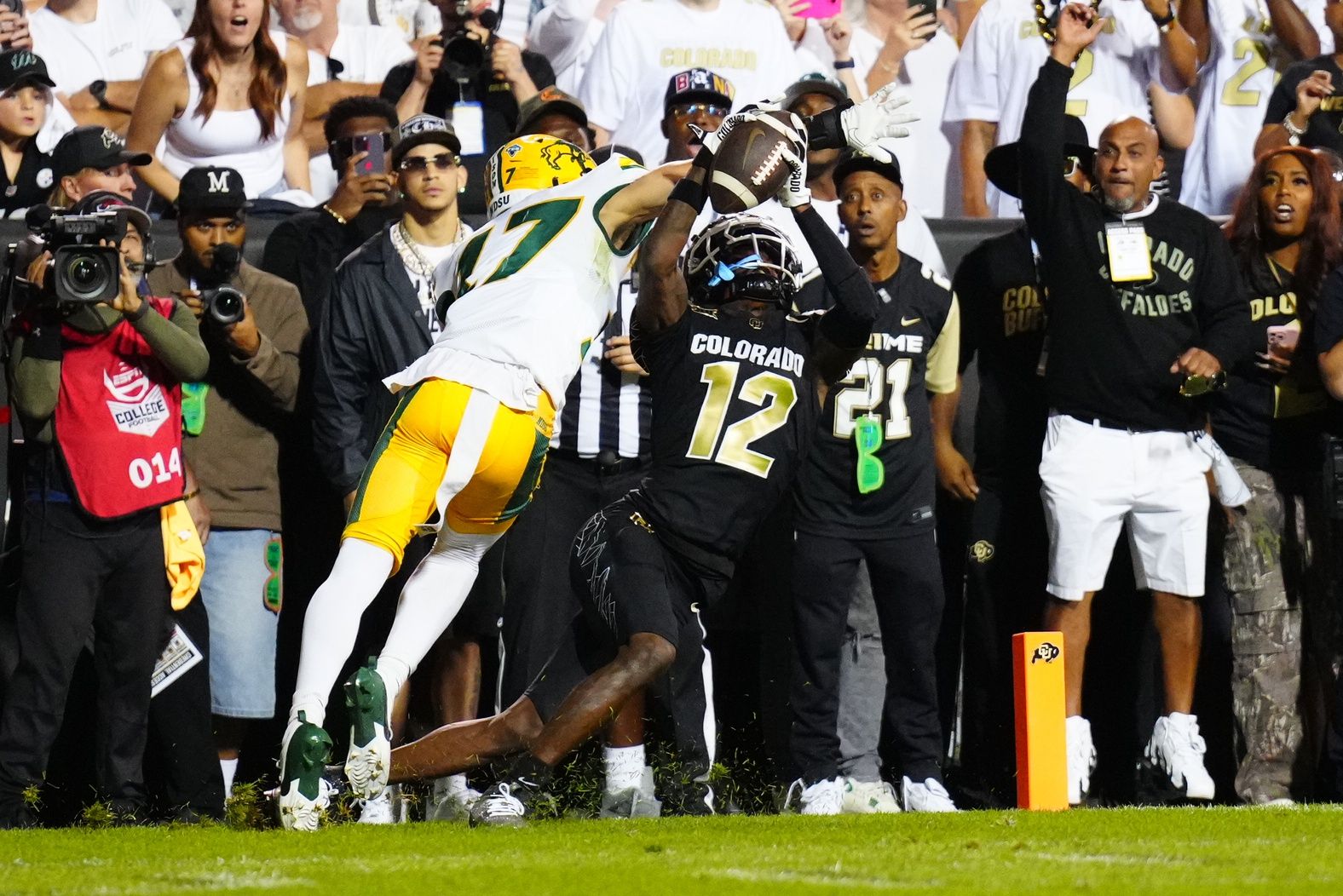 Colorado Buffaloes wide receiver Travis Hunter (12) pulls in a touchdown reception past North Dakota State Bison cornerback Jailen Duffie (17) in the second half at Folsom Field. Mandatory Credit: Ron Chenoy-USA TODAY Sports