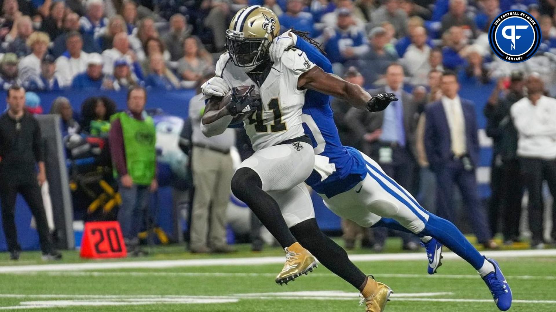 Indianapolis Colts cornerback Jaylon Jones (40) hangs onto New Orleans Saints running back Alvin Kamara (41) as he runs in a touchdown Sunday, Oct. 29, 2023, at Lucas Oil Stadium in Indianapolis. The Colts lost to the Saints, 38-27.