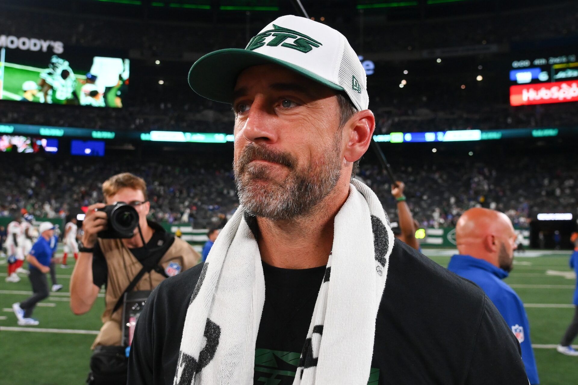 New York Jets quarterback Aaron Rodgers (8) walks on the field following the game against the New York Giants at MetLife Stadium.