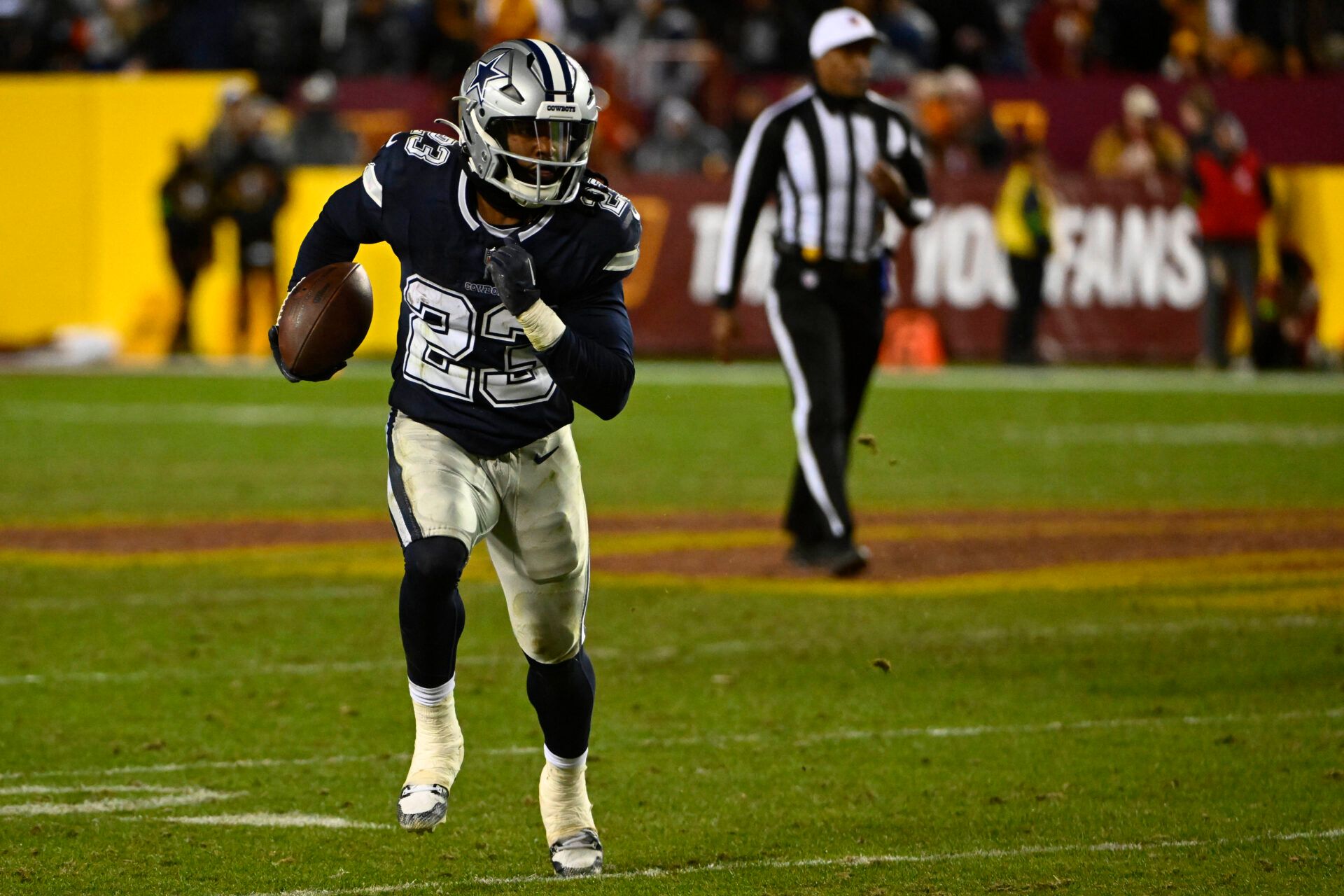 Jan 7, 2024; Landover, Maryland, USA; Dallas Cowboys running back Rico Dowdle (23) runs after a catch against the Washington Commanders during the second half at FedExField. Mandatory Credit: Brad Mills-USA TODAY Sports