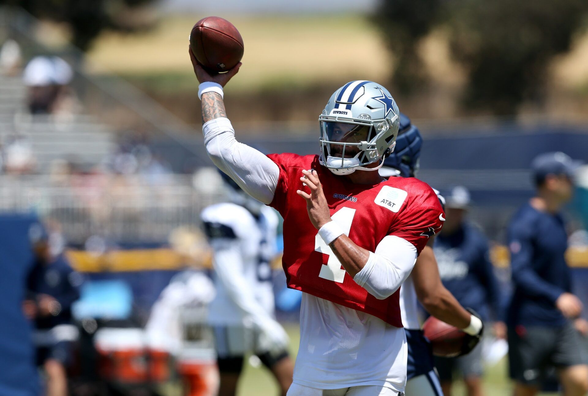 Dallas Cowboys quarterback Dak Prescott (4) throws during training camp at the River Ridge Playing Fields in Oxnard, California.