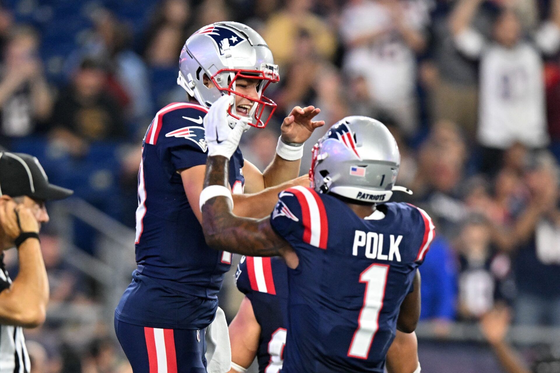 New England Patriots quarterback Drake Maye (10) celebrates with wide receiver Ja'Lynn Polk (1) after scoring a touchdown against the Philadelphia Eagles during the first half at Gillette Stadium.