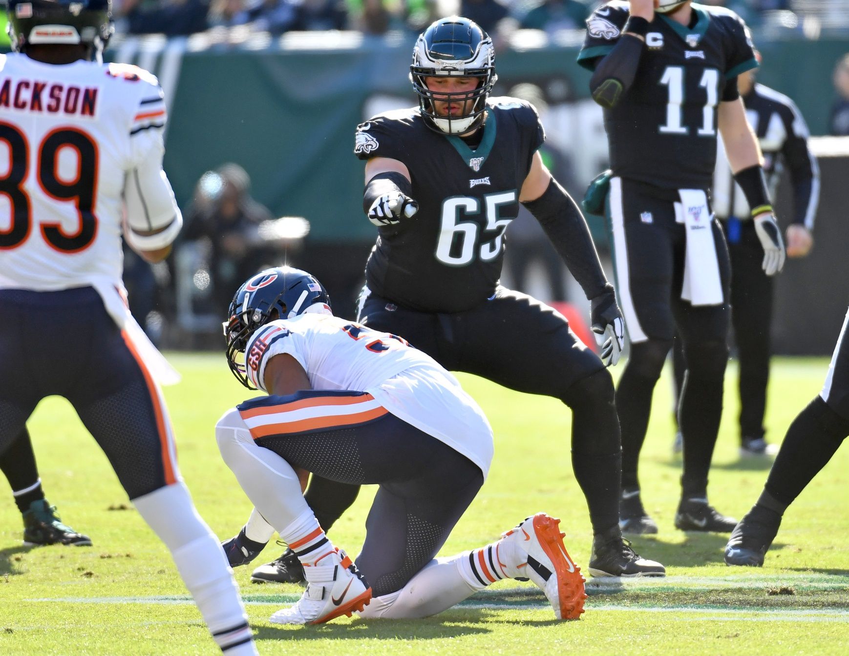 Philadelphia Eagles offensive tackle Lane Johnson (65) points to Chicago Bears outside linebacker Khalil Mack (52) who called for offside during the first quarter at Lincoln Financial Field. Mandatory Credit: Eric Hartline-USA TODAY Sports