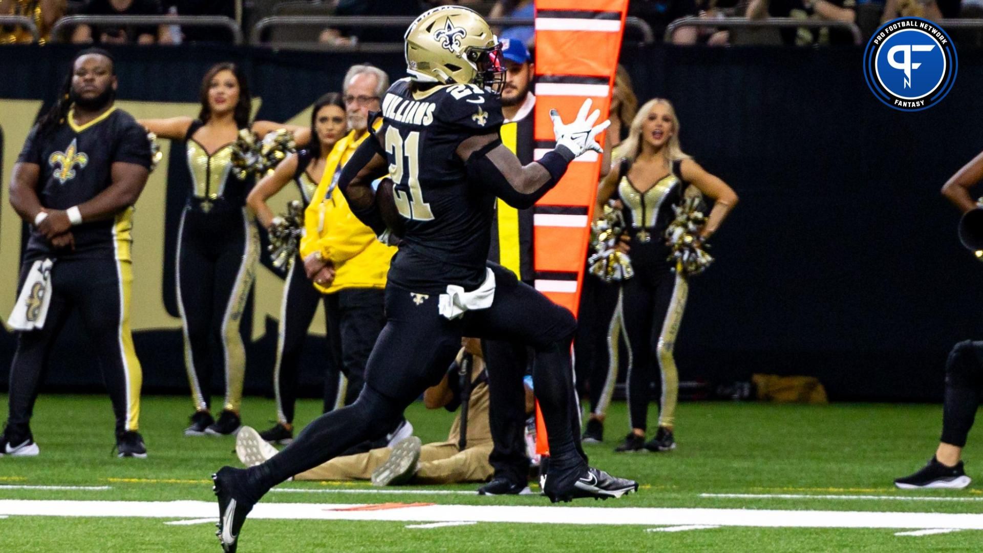 Sep 8, 2024; New Orleans, Louisiana, USA; New Orleans Saints running back Jamaal Williams (21) scores a 14-yard touchdown run against the Carolina Panthers during the second half at Caesars Superdome. Mandatory Credit: Stephen Lew-Imagn Images