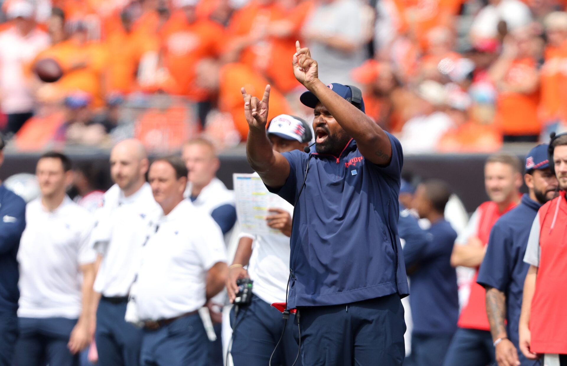 New England Patriots head coach Jerod Mayo call a play during the second quarter against the Cincinnati Bengals at Paycor Stadium.