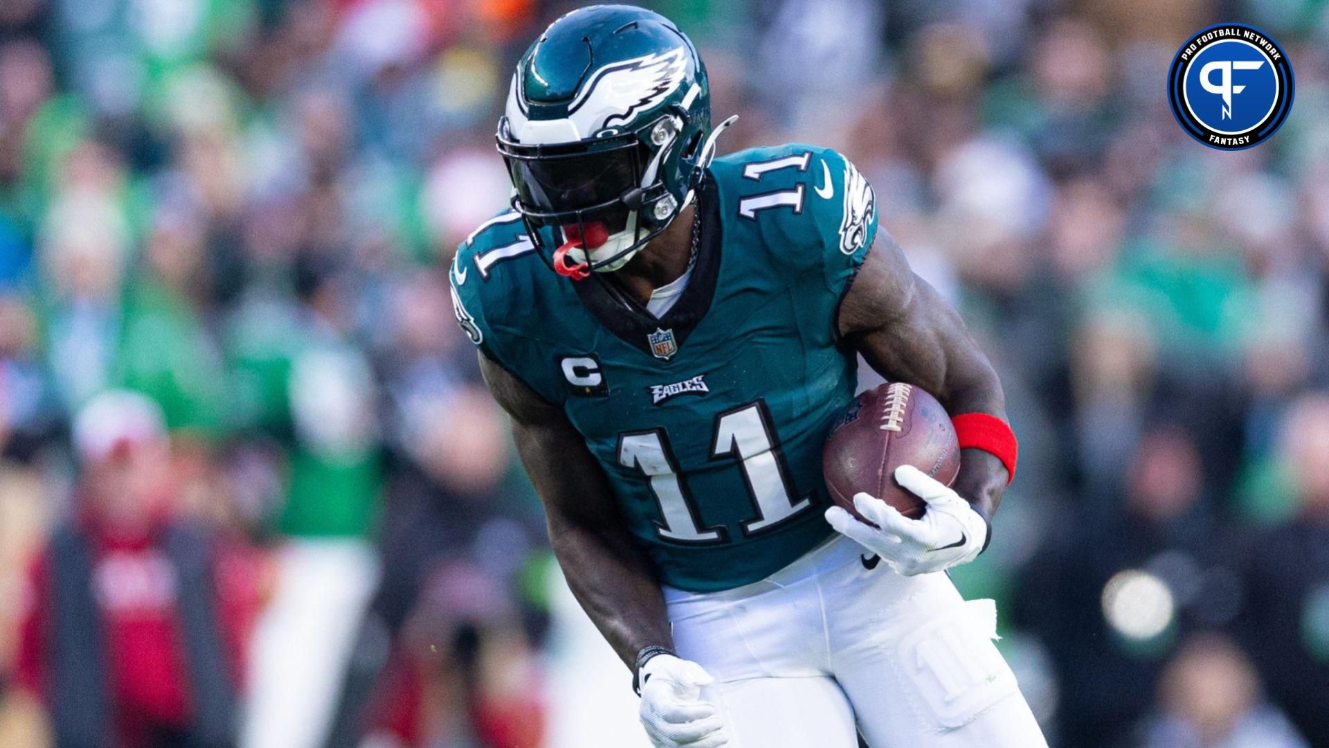 Dec 31, 2023; Philadelphia, Pennsylvania, USA; Philadelphia Eagles wide receiver A.J. Brown (11) runs with the ball during the fourth quarter against the Arizona Cardinals at Lincoln Financial Field. Mandatory Credit: Bill Streicher-Imagn Images