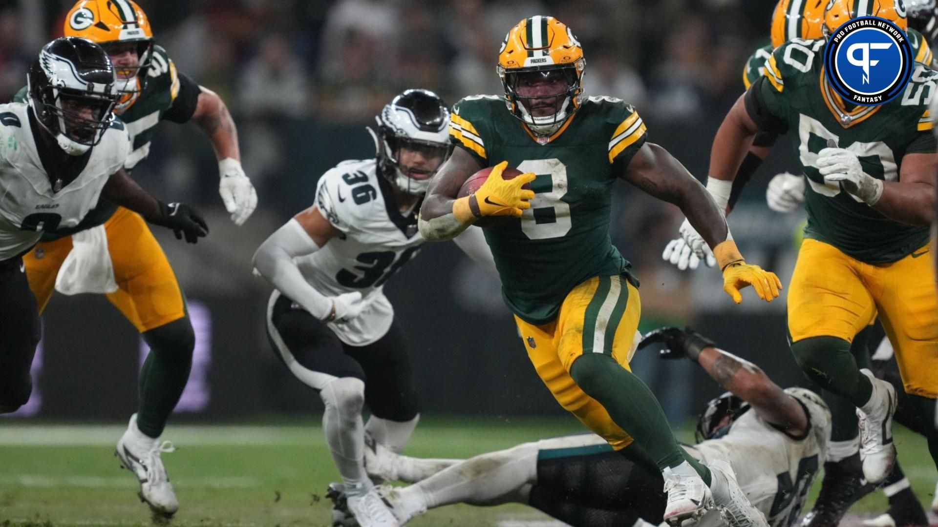 Green Bay Packers running back Josh Jacobs (8) runs during the second half against the Philadelphia Eagles at Neo Quimica Arena.