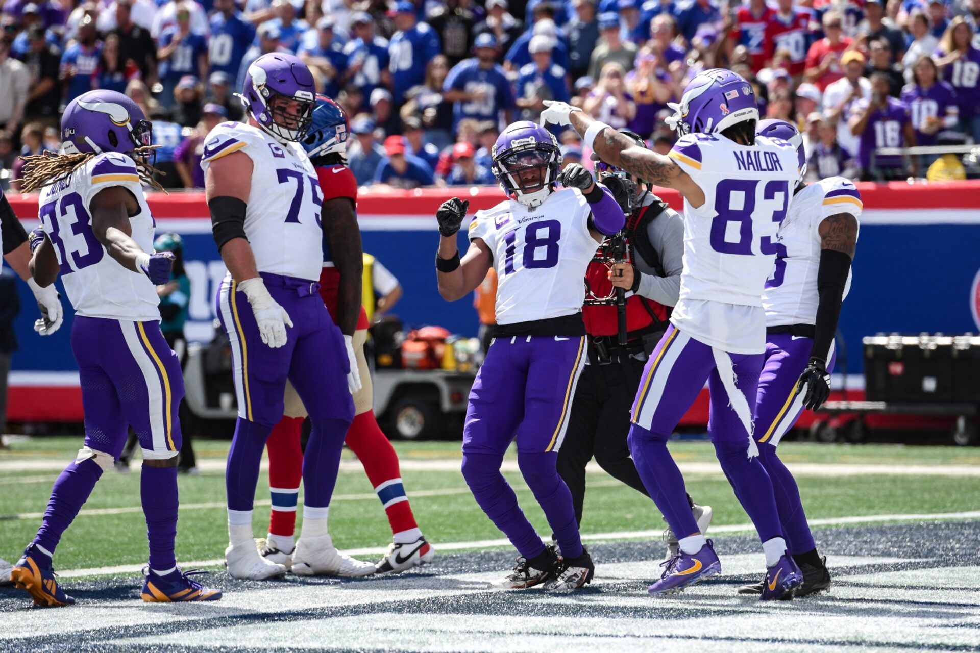 Sep 8, 2024; East Rutherford, New Jersey, USA; Minnesota Vikings wide receiver Justin Jefferson (18) celebrates after scoring a touchdown against the New York Giants during the first half at MetLife Stadium. Mandatory Credit: John Jones-Imagn Images