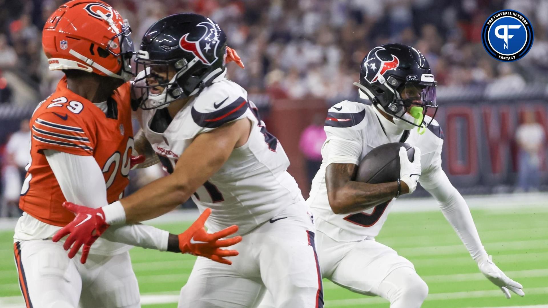 Houston Texans wide receiver Tank Dell (3) runs after the catch against the Chicago Bears in the first quarter at NRG Stadium.