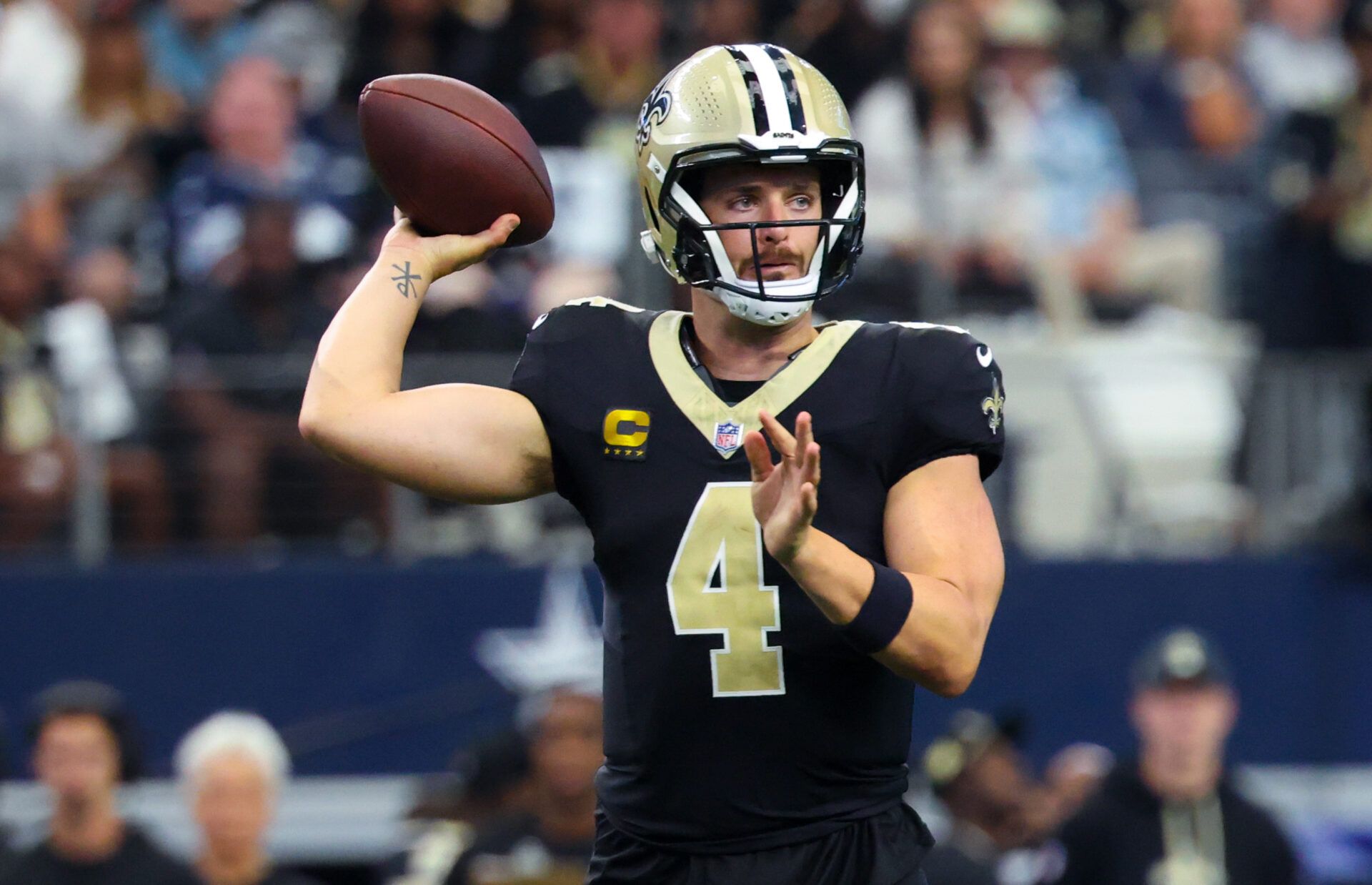 Sep 15, 2024; Arlington, Texas, USA; New Orleans Saints quarterback Derek Carr (4) throws during the first half against the Dallas Cowboys at AT&T Stadium. Mandatory Credit: Kevin Jairaj-Imagn Images