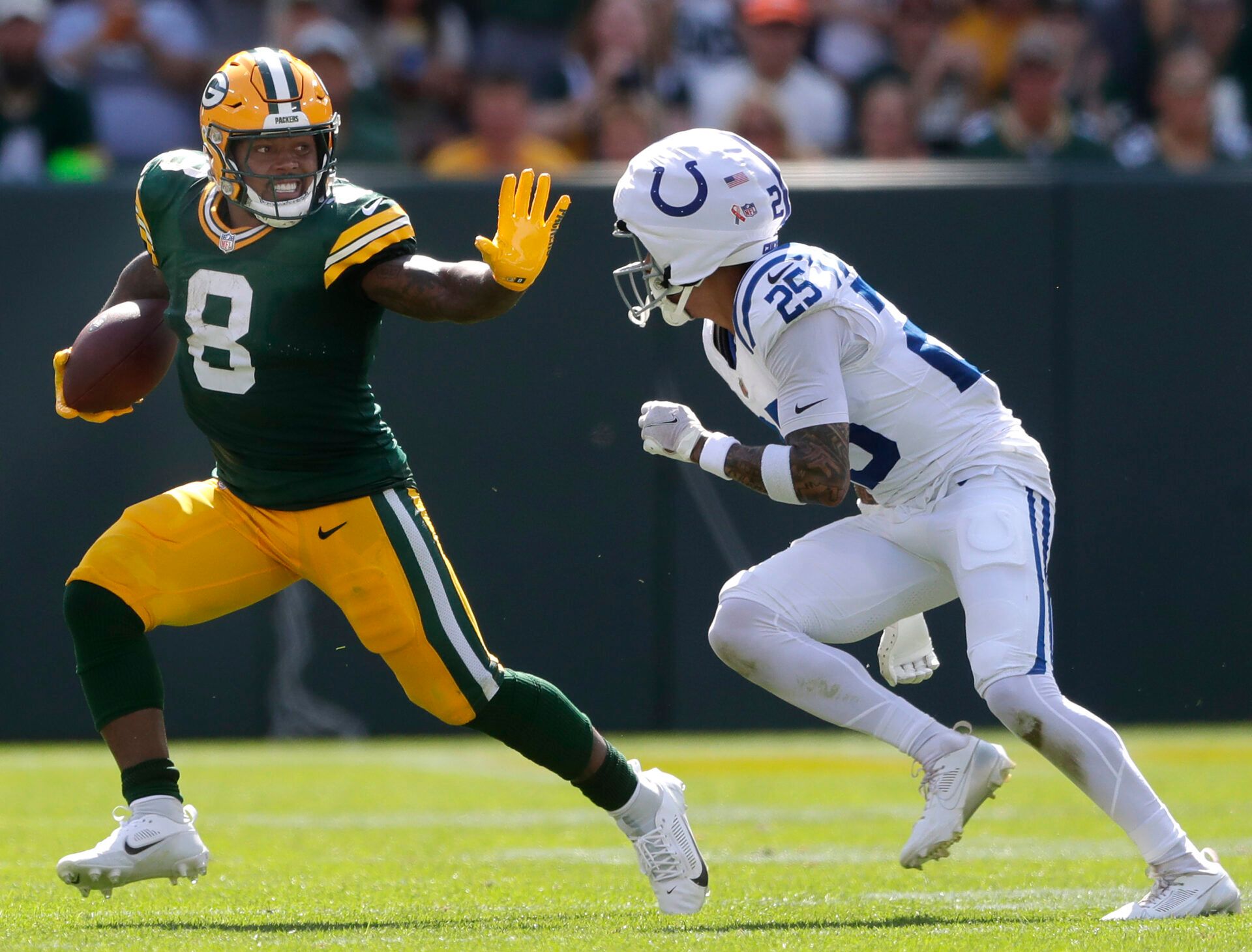 Sep 15, 2024; Green Bay, Wisconsin, USA; Green Bay Packers running back Josh Jacobs (8) against Indianapolis Colts safety Rodney Thomas II (25) at Lambeau Field. Mandatory Credit: Wm. Glasheen/USA TODAY Network via Imagn Images