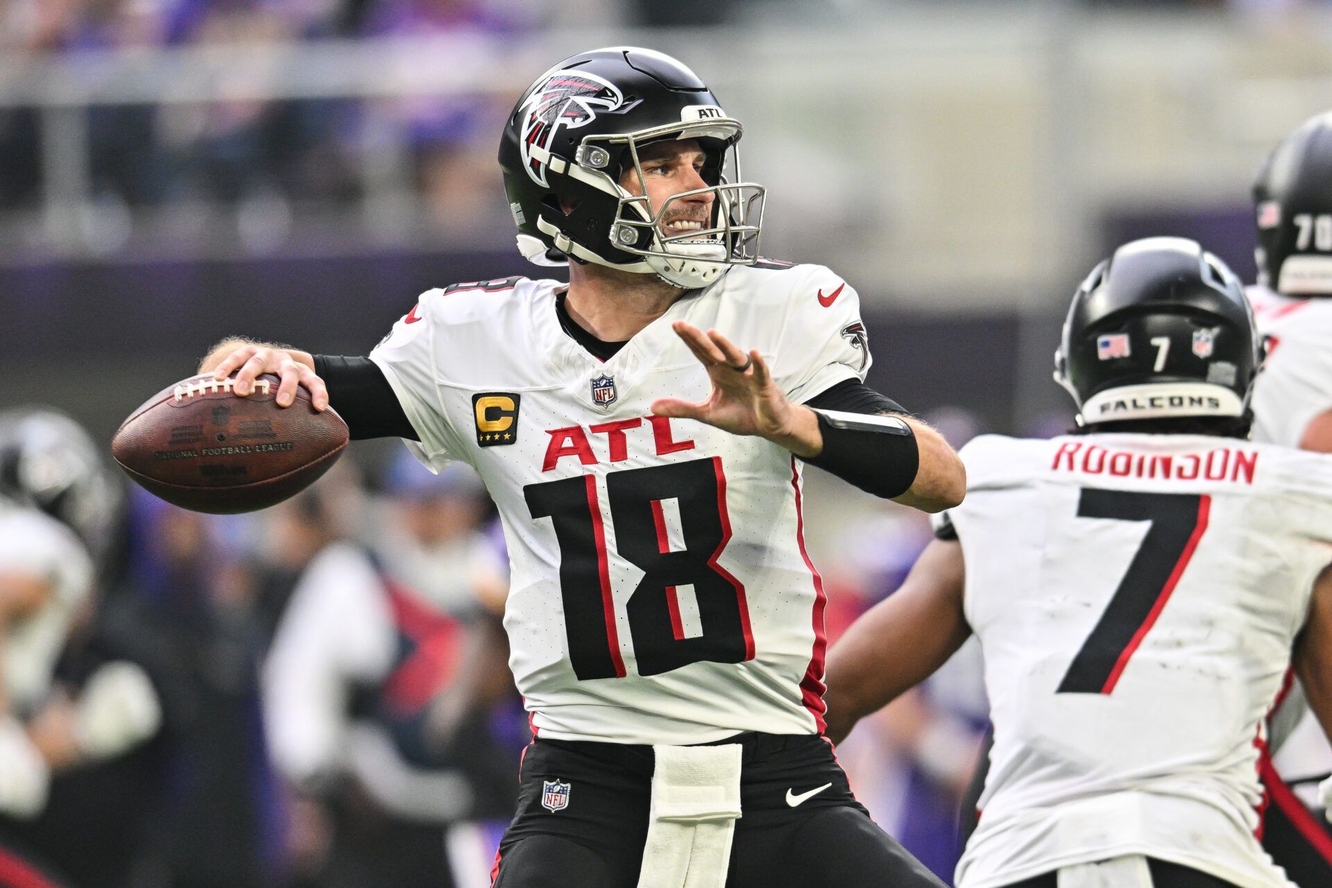 Dec 8, 2024; Minneapolis, Minnesota, USA; Atlanta Falcons quarterback Kirk Cousins (18) throws a pass against the Minnesota Vikings during the second quarter at U.S. Bank Stadium. Mandatory Credit: Jeffrey Becker-Imagn Images