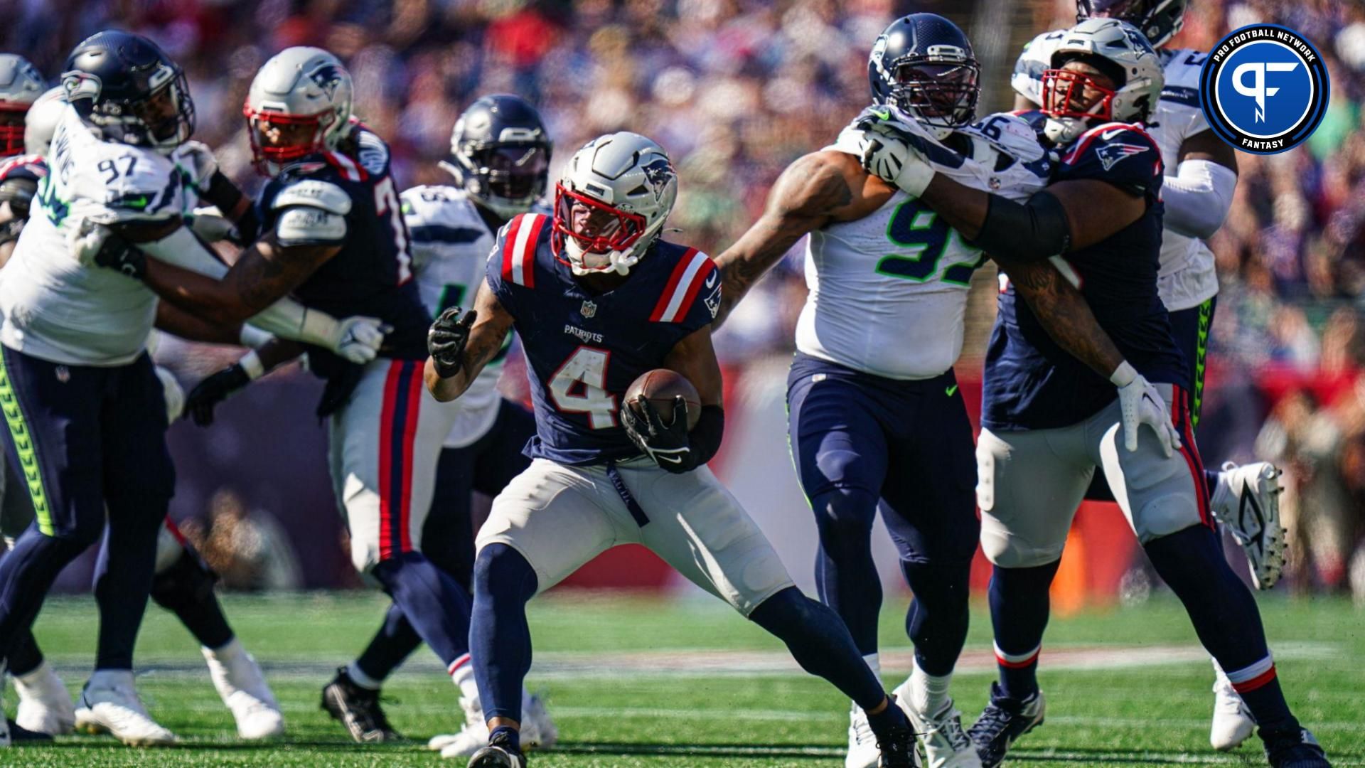 New England Patriots running back Antonio Gibson (4) runs the ball against the Seattle Seahawks in the second half at Gillette Stadium.