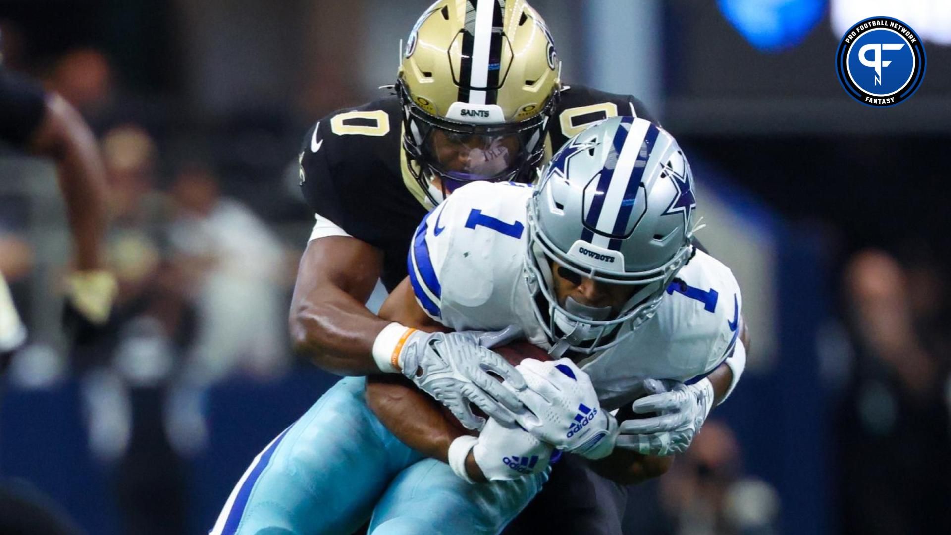 New Orleans Saints safety Ugo Amadi (0) tackles Dallas Cowboys wide receiver Jalen Tolbert (1) during the first half at AT&T Stadium. Mandatory Credit: Kevin Jairaj-Imagn Images