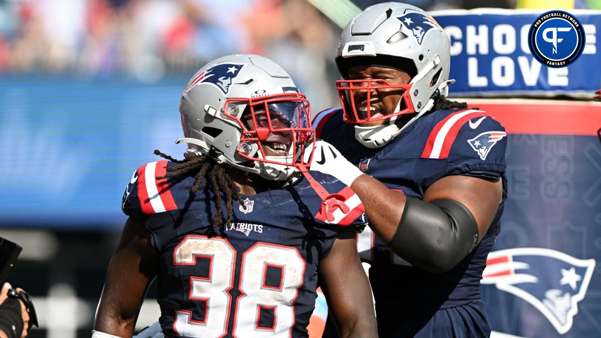 New England Patriots running back Rhamondre Stevenson (38) celebrates with offensive tackle Caedan Wallace (70) after scoring a touchdown against the Seattle Seahawks during the second half at Gillette Stadium. Mandatory Credit: Brian Fluharty-Imagn Images