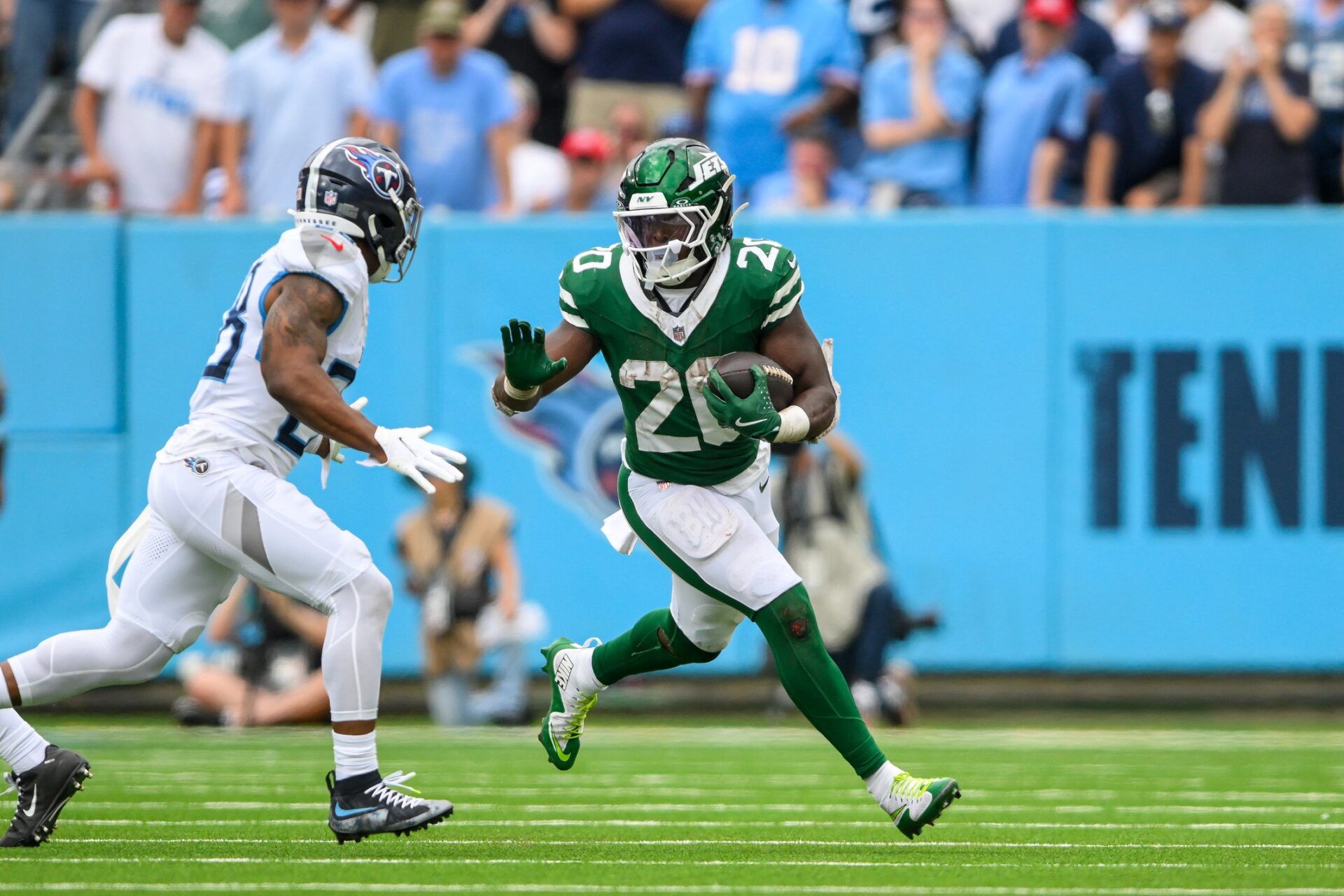 New York Jets running back Breece Hall (20) runs the ball against the New York Jets during the second half at Nissan Stadium. How does he fare in our Thursday Night Football prop bets?