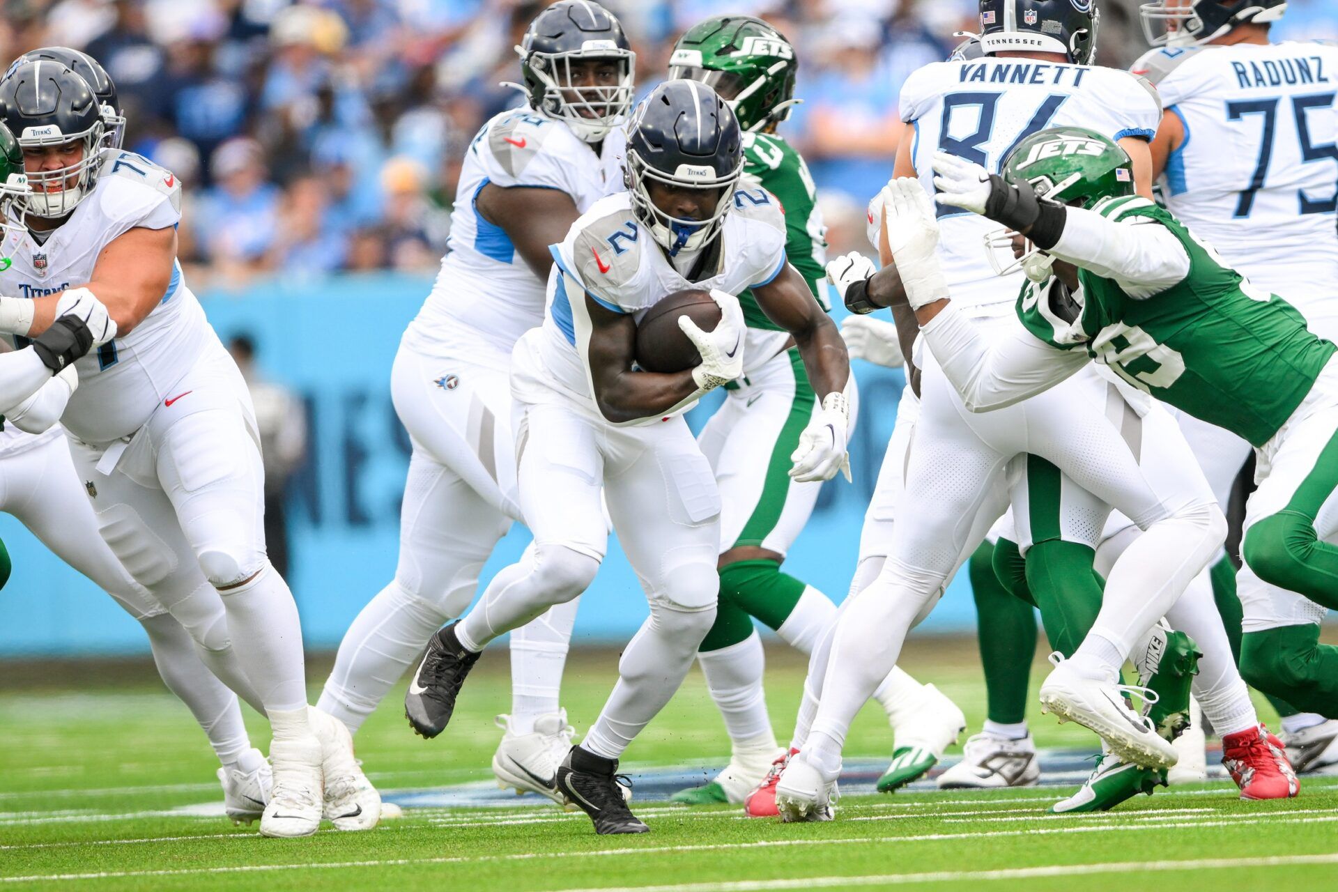 Sep 15, 2024; Nashville, Tennessee, USA; Tennessee Titans running back Tyjae Spears (2) runs the ball against the New York Jets during the first half during the first half at Nissan Stadium. Mandatory Credit: Steve Roberts-Imagn Images